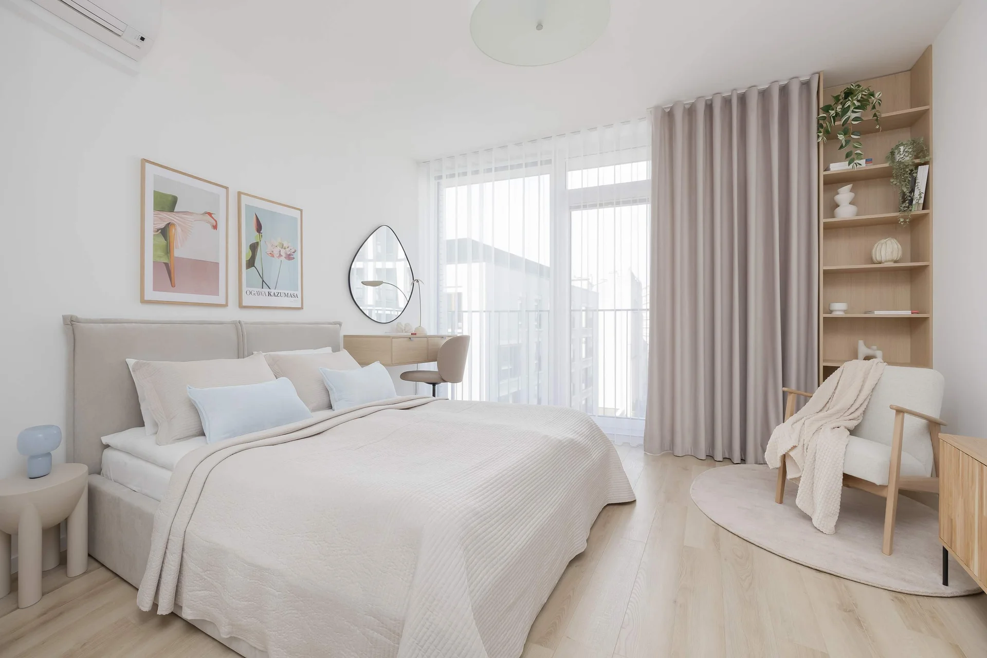 Bright studio apartment with cozy bed and natural light