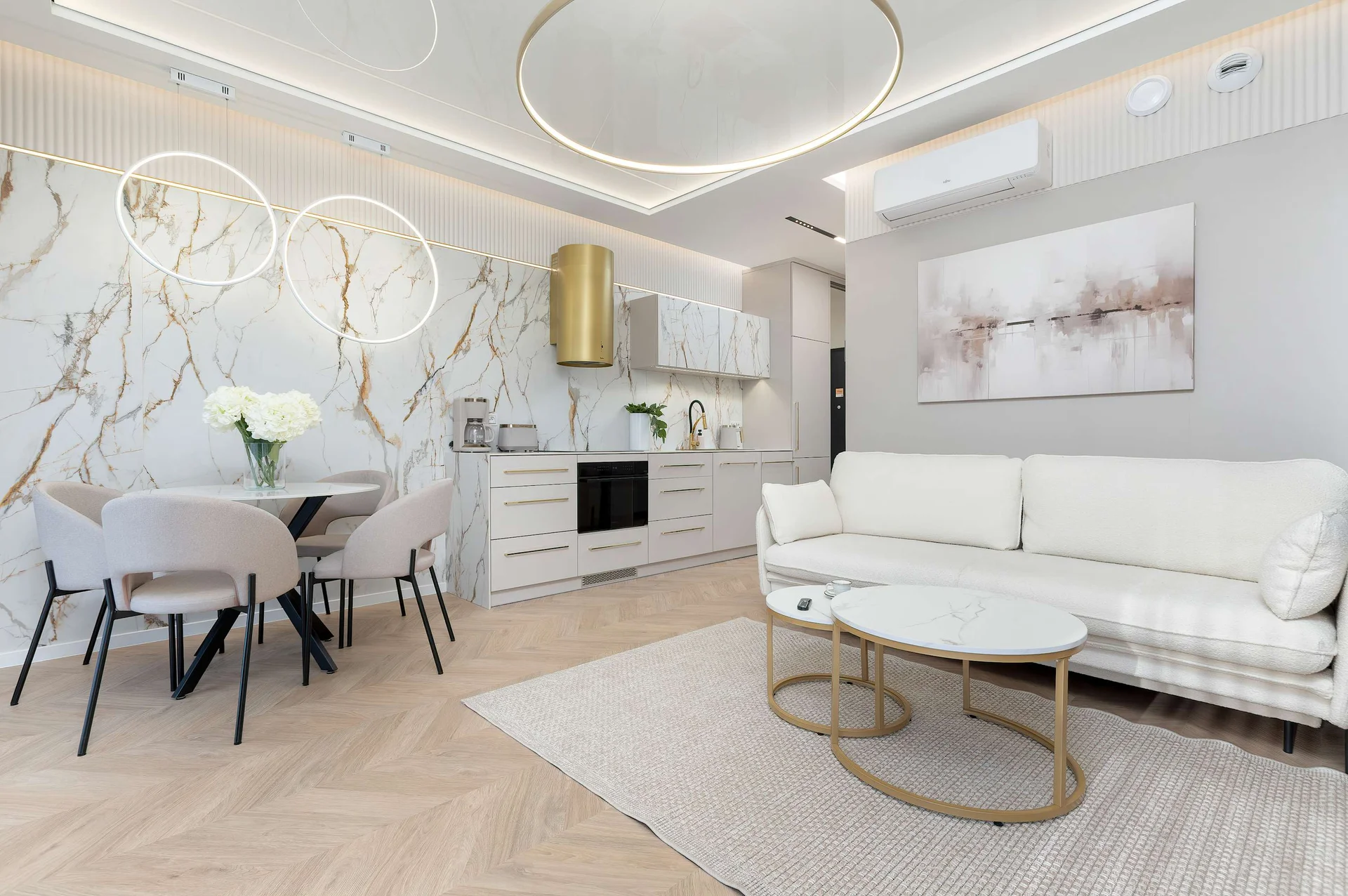 Elegant studio apartment with luxury decor, dining area and soft beige accents