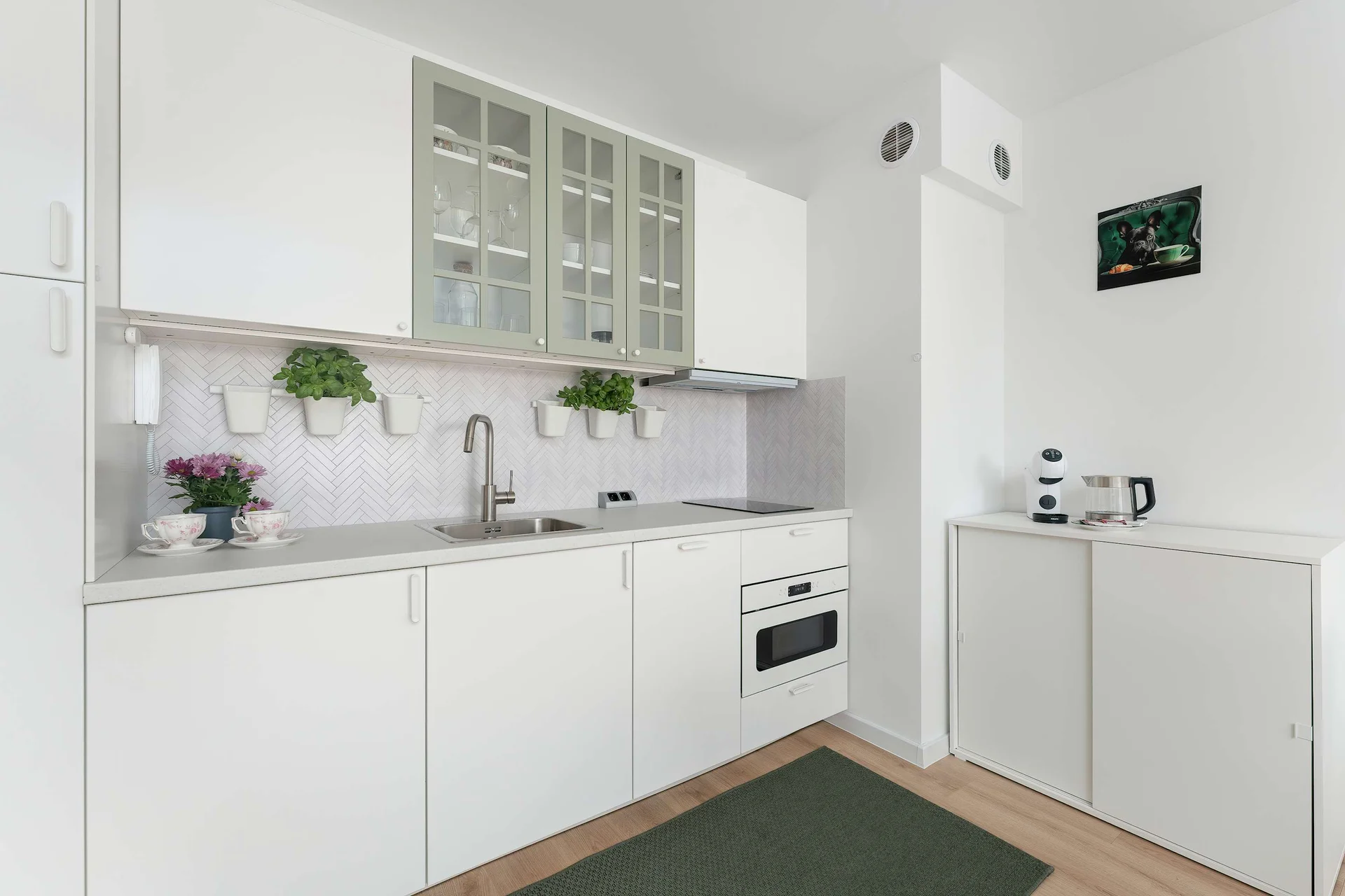 The fully equipped kitchenette includes everything you need for a home-cooked meal.