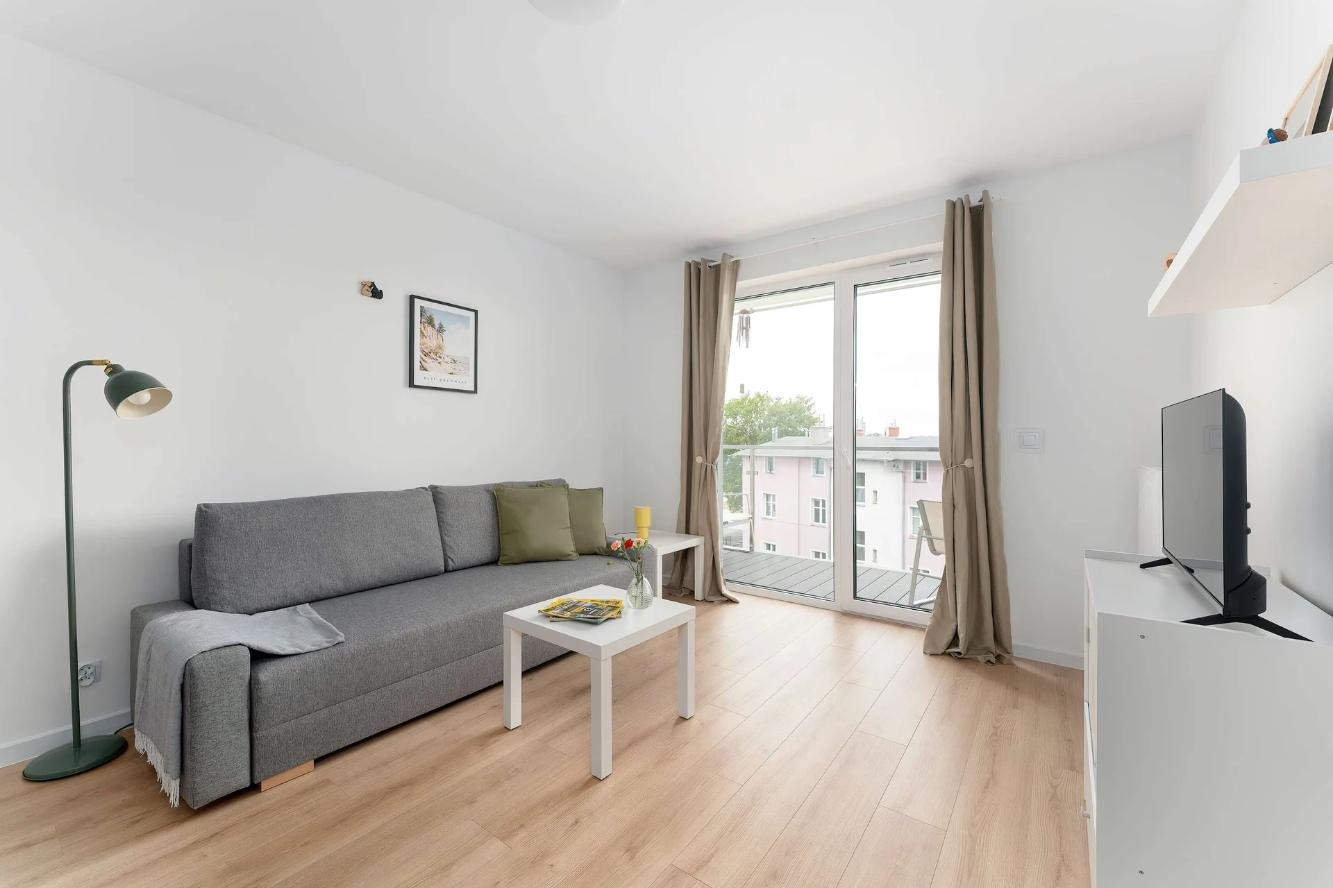 Relax in the stylish living room with a comfortable sofa and modern decor.