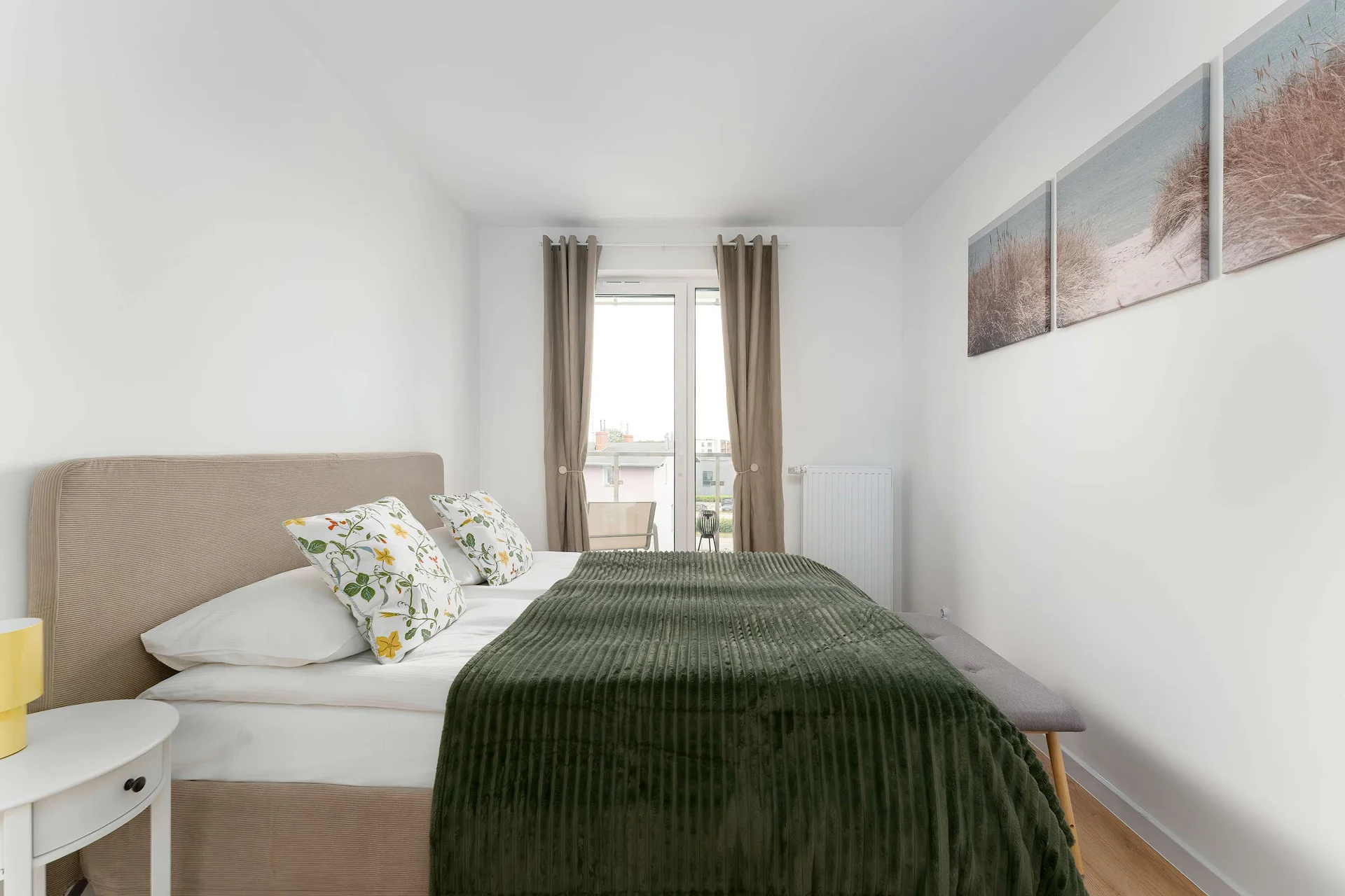The cosy bedroom features a luxurious double bed and ample storage.