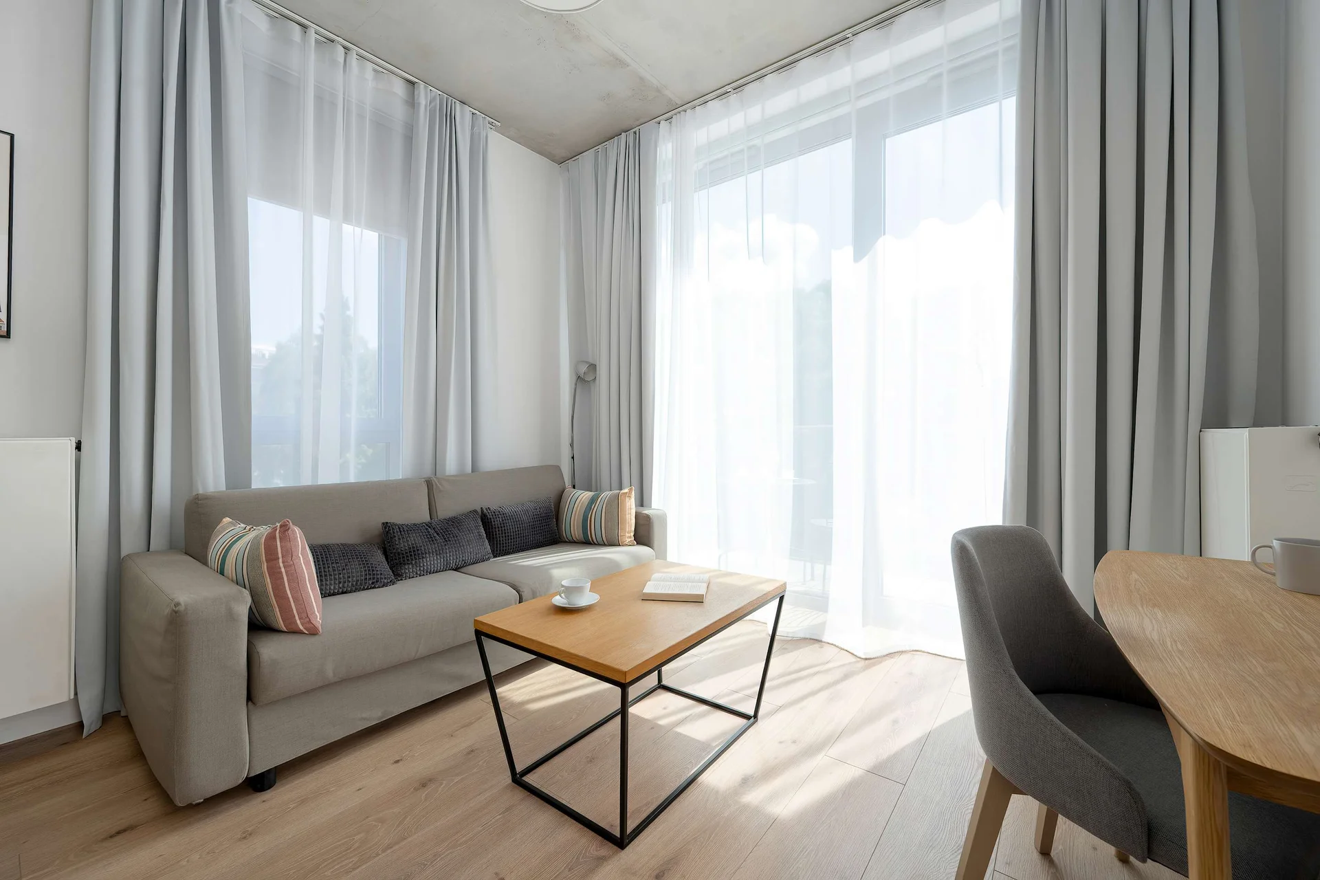 Relax in the stylish living room with a comfortable sofa and modern decor.