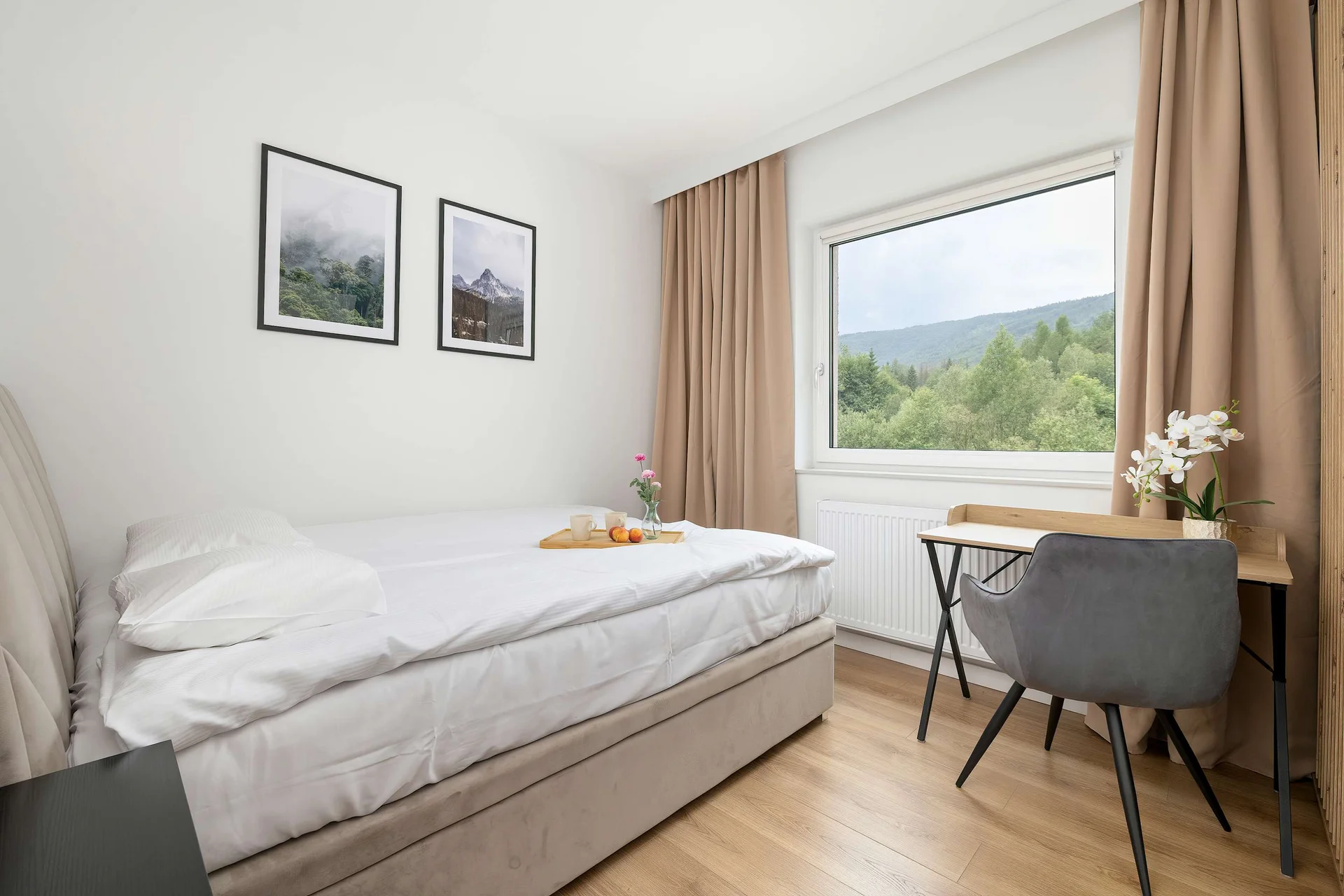 The cosy bedroom features a luxurious double bed and ample storage.