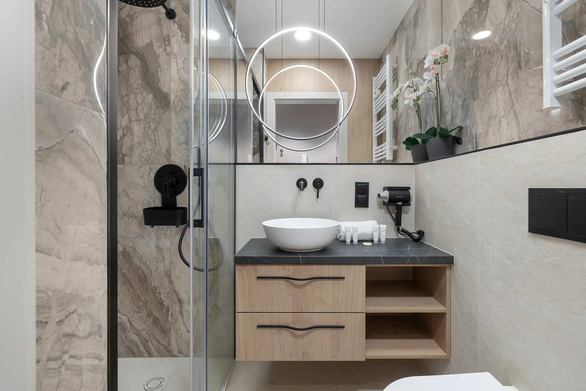 The bathroom offers a clean and functional space for your stay.