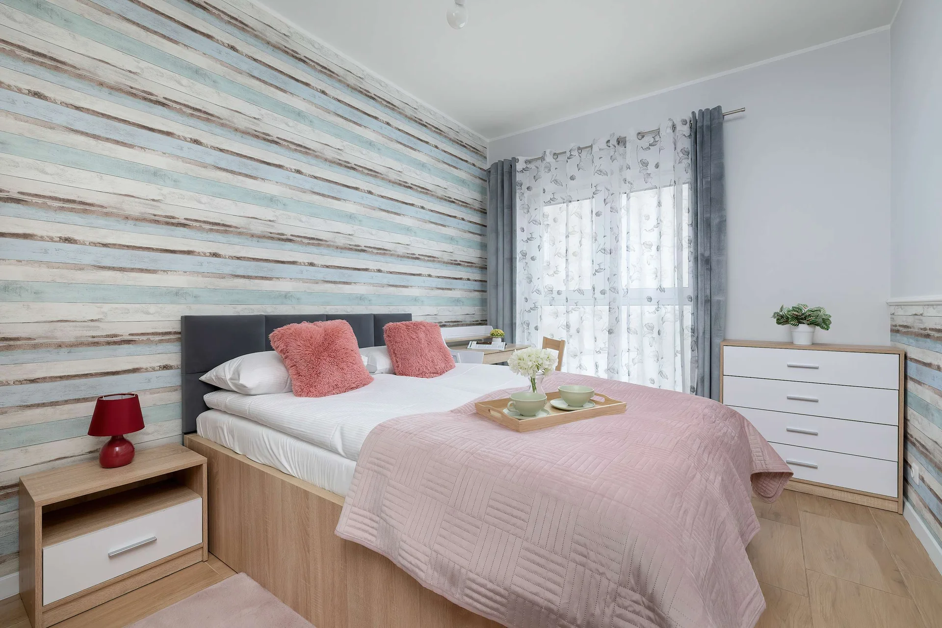 The bedroom's elegant decor creates a serene and restful environment.