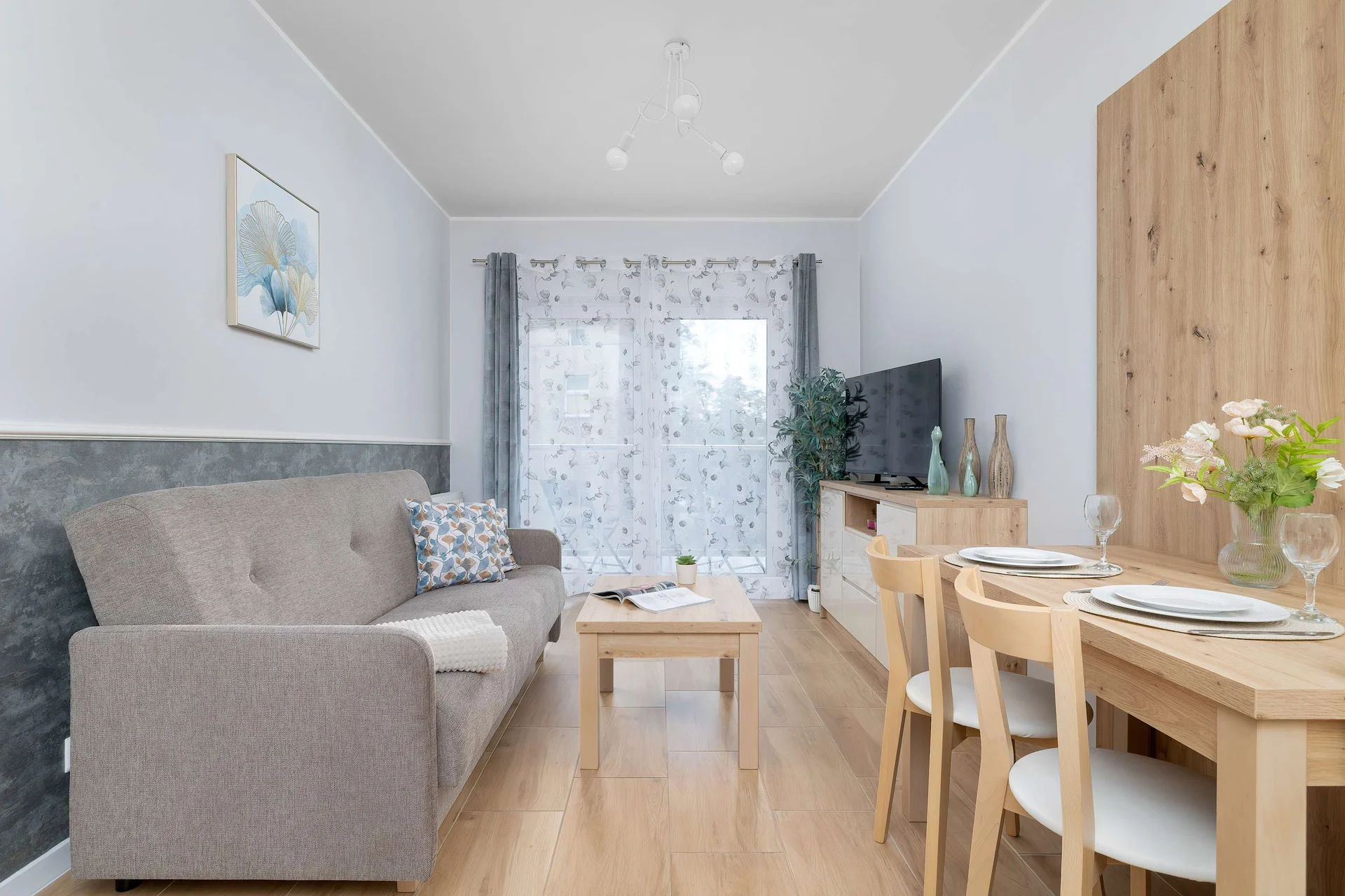Relax in the stylish living room with a comfortable sofa and modern decor.