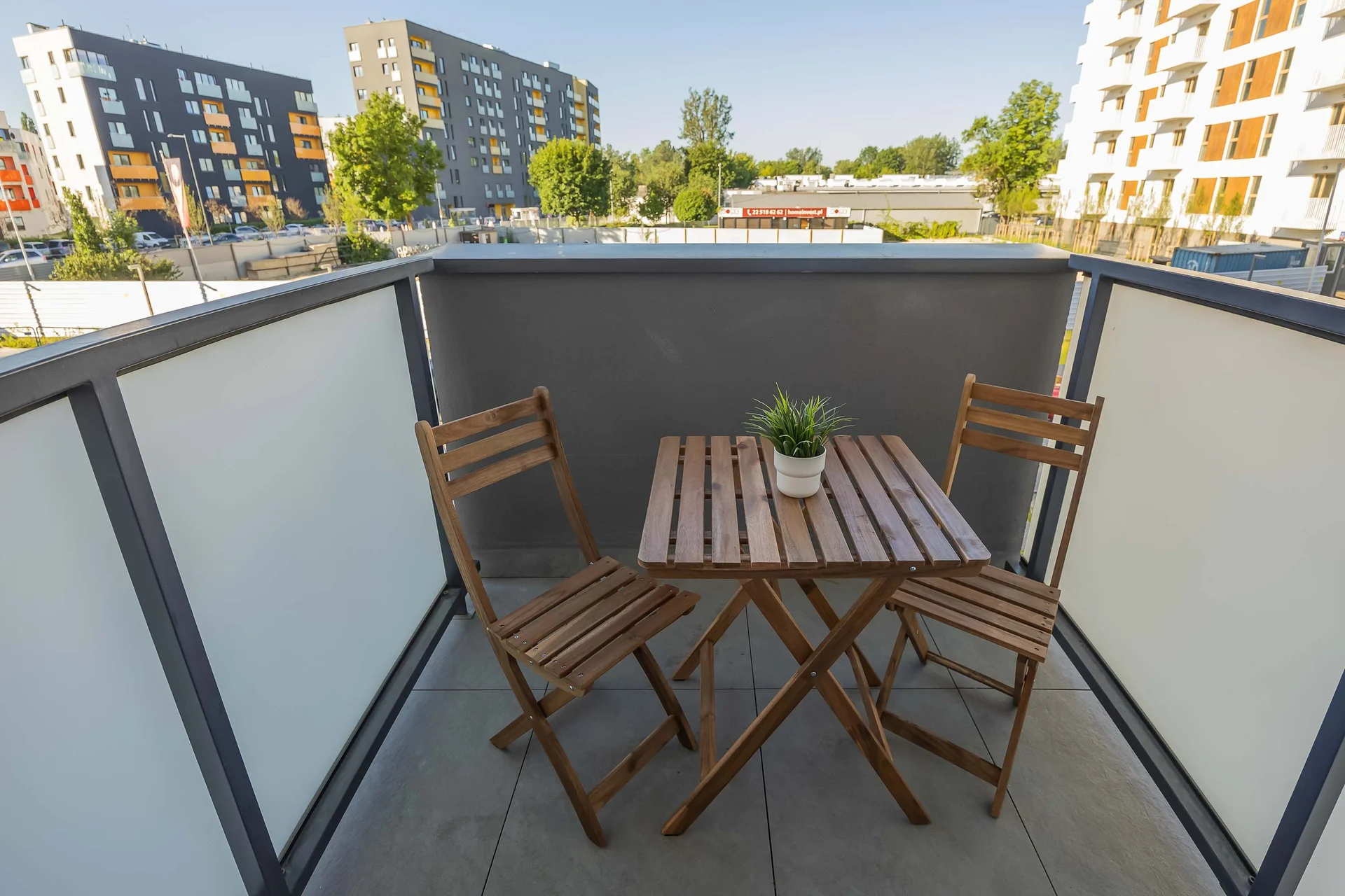 Private balcony with outdoor seating area.