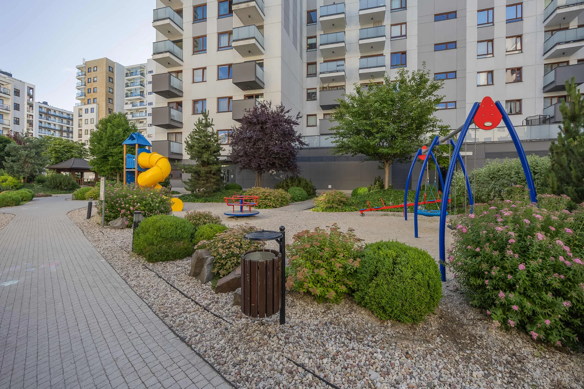 Landscaped courtyard with a children's playground.