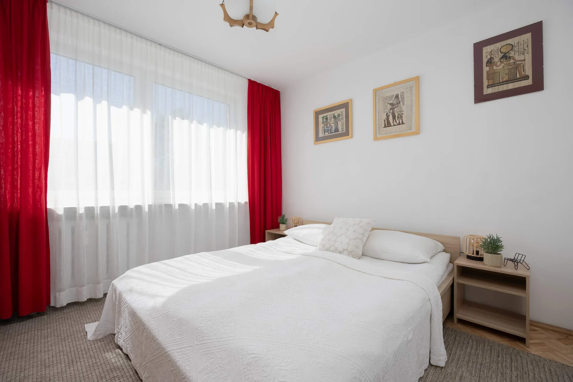 The cosy bedroom features a luxurious double bed and ample storage.