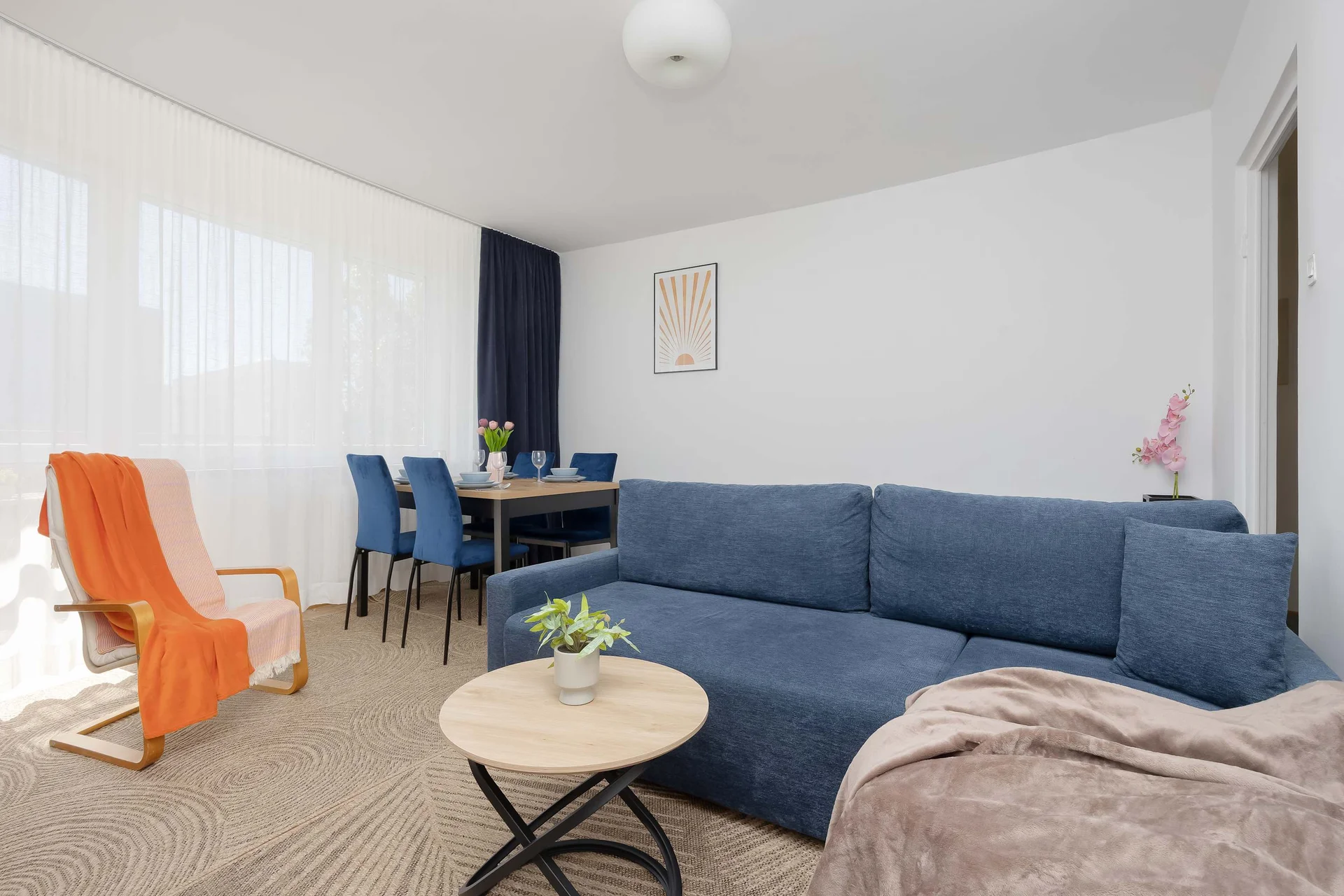 Relax in the stylish living room with a comfortable sofa.