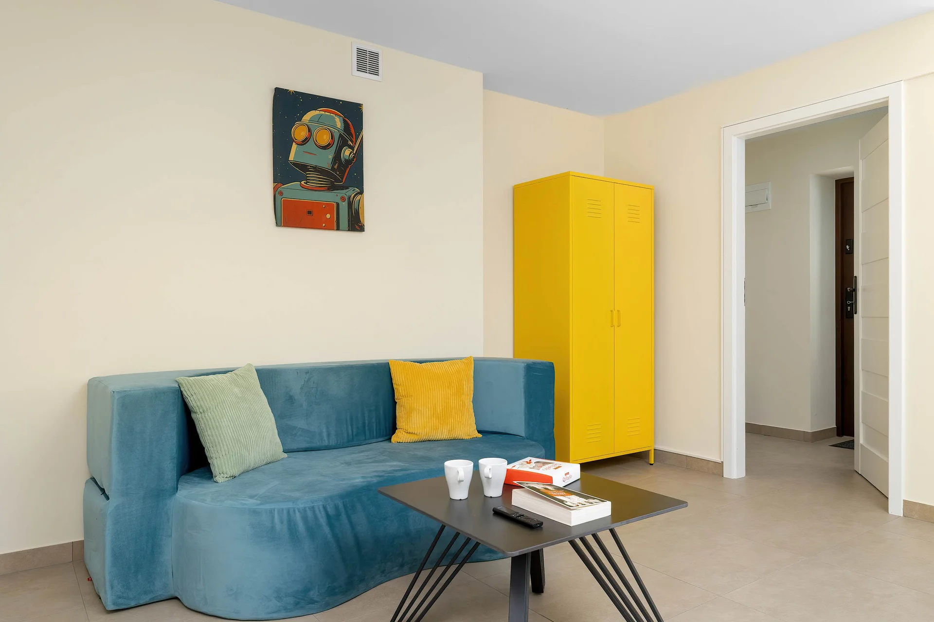 Relax in the stylish living room with a comfortable sofa and modern decor.