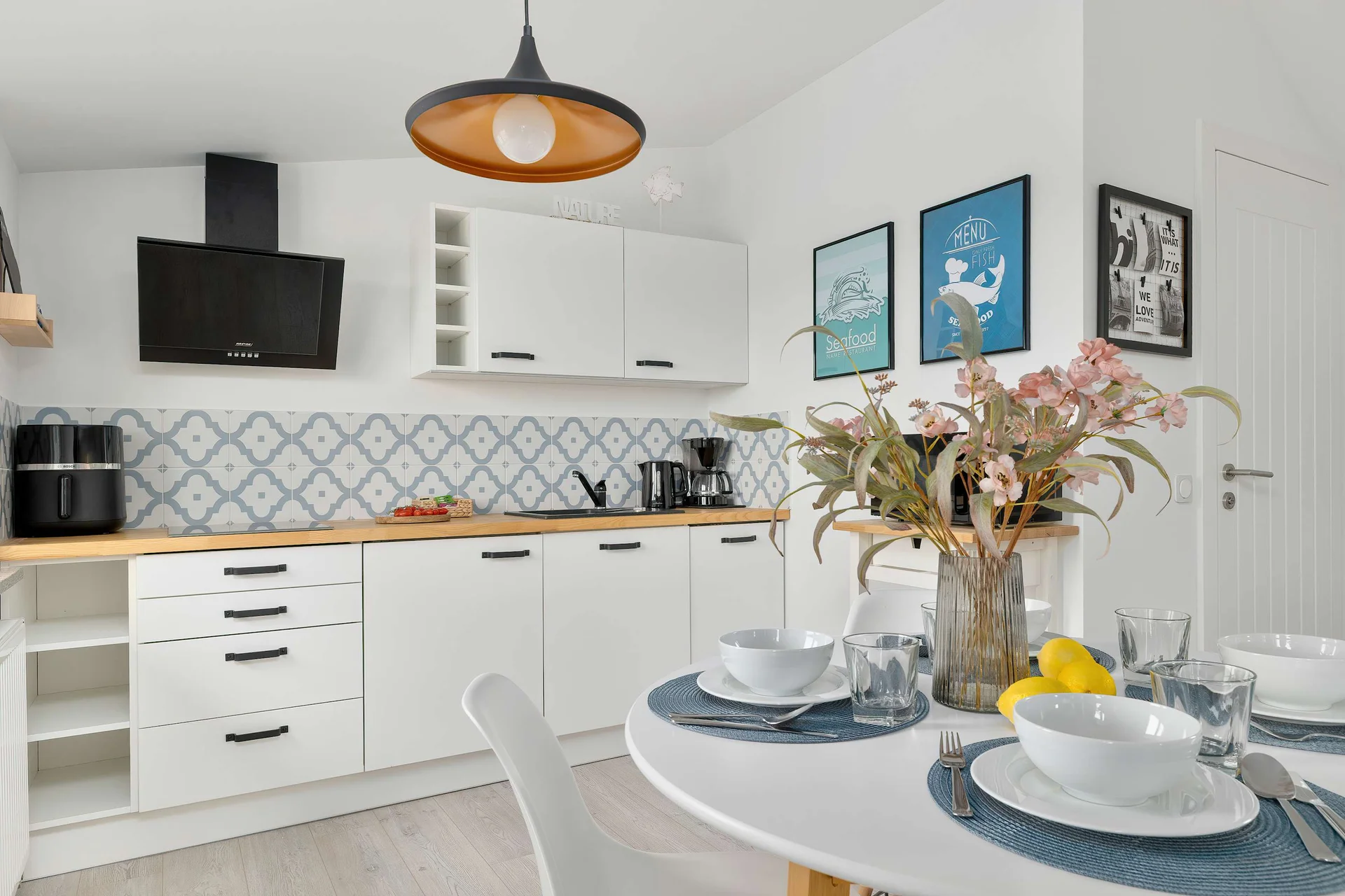 Modern kitchenette with everything needed to prepare meals, seamlessly connected to the living area.
