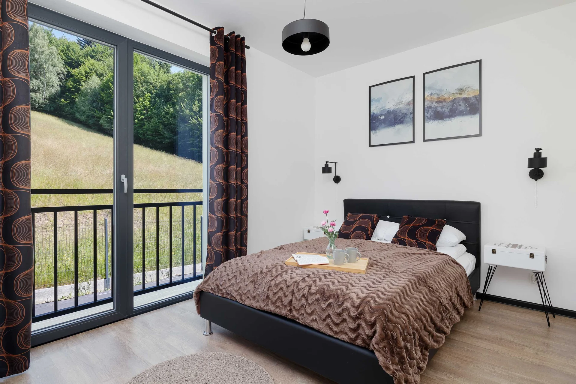 The bedroom's modern design ensures a comfortable stay.