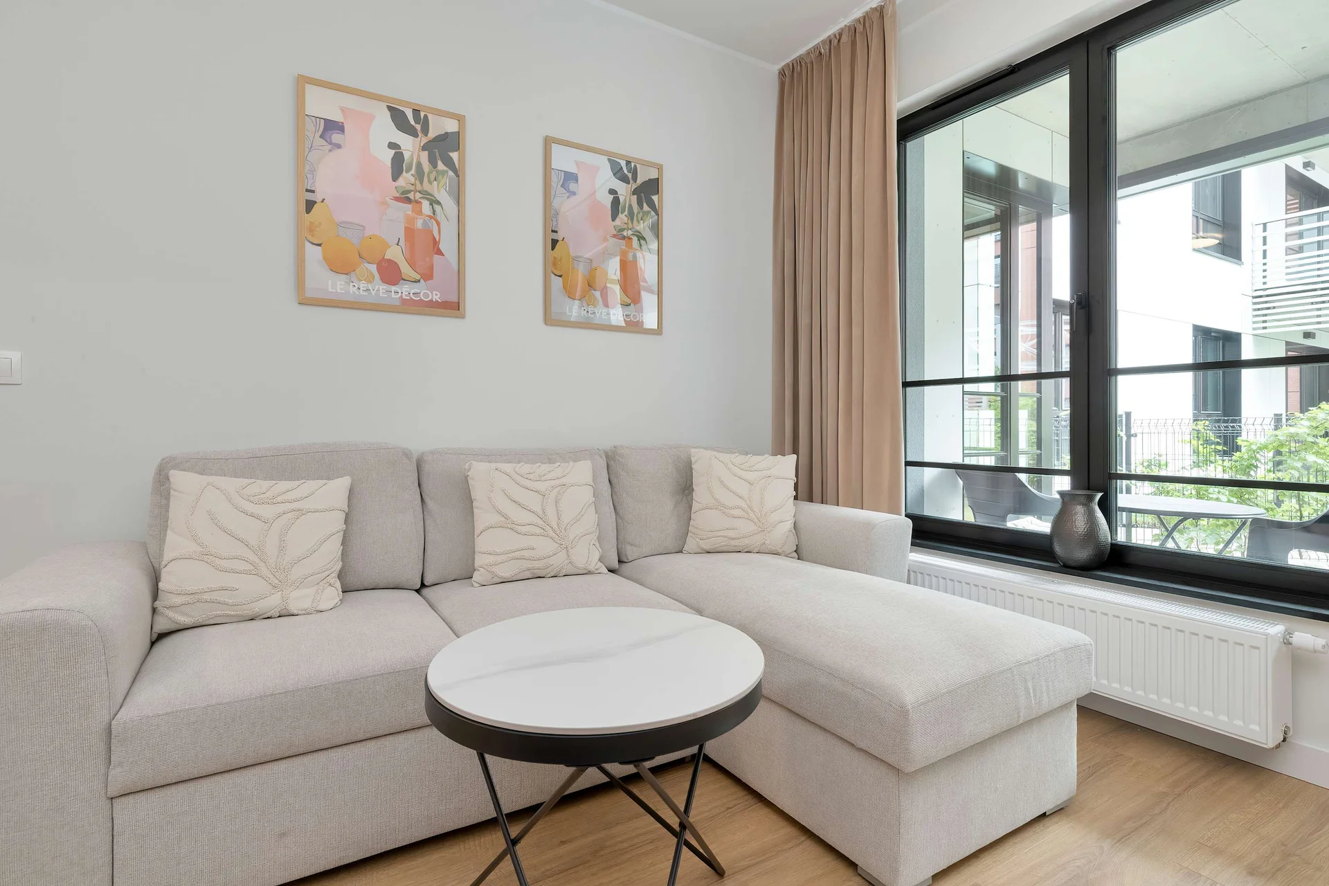 Relax in the stylish living room with a comfortable sofa and modern decor.