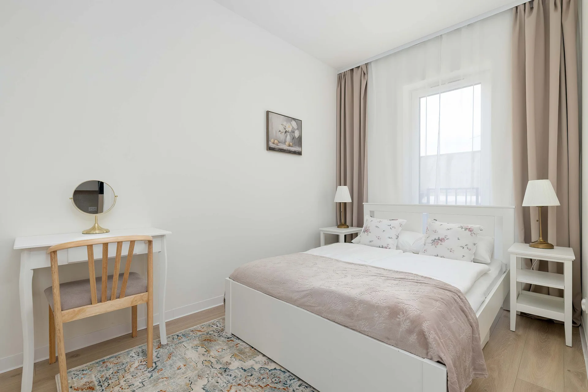 Cozy bedroom with a double bed, bedside tables, and plenty of natural light.