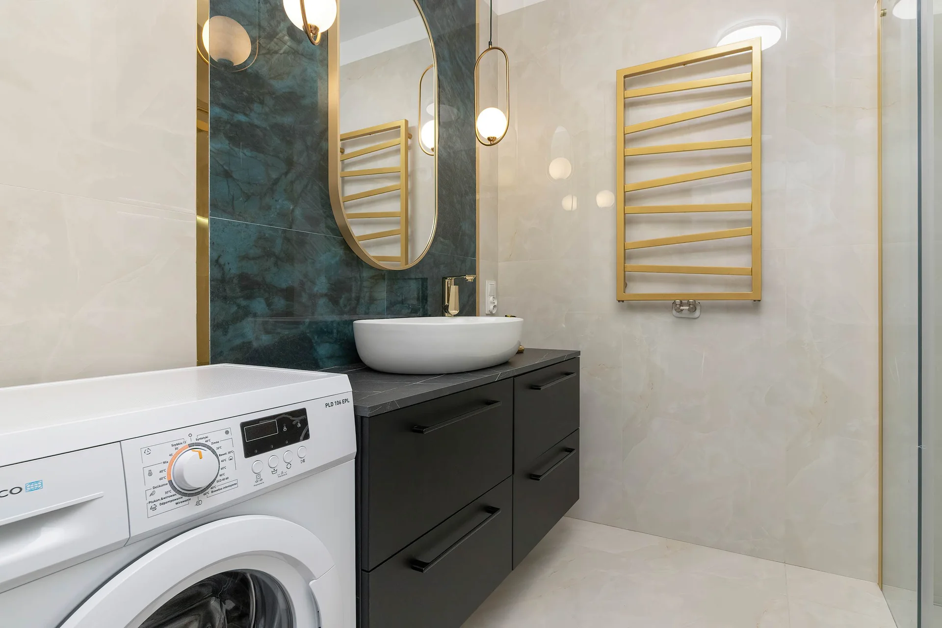 The bathroom's contemporary design includes fresh towels and a hairdryer.