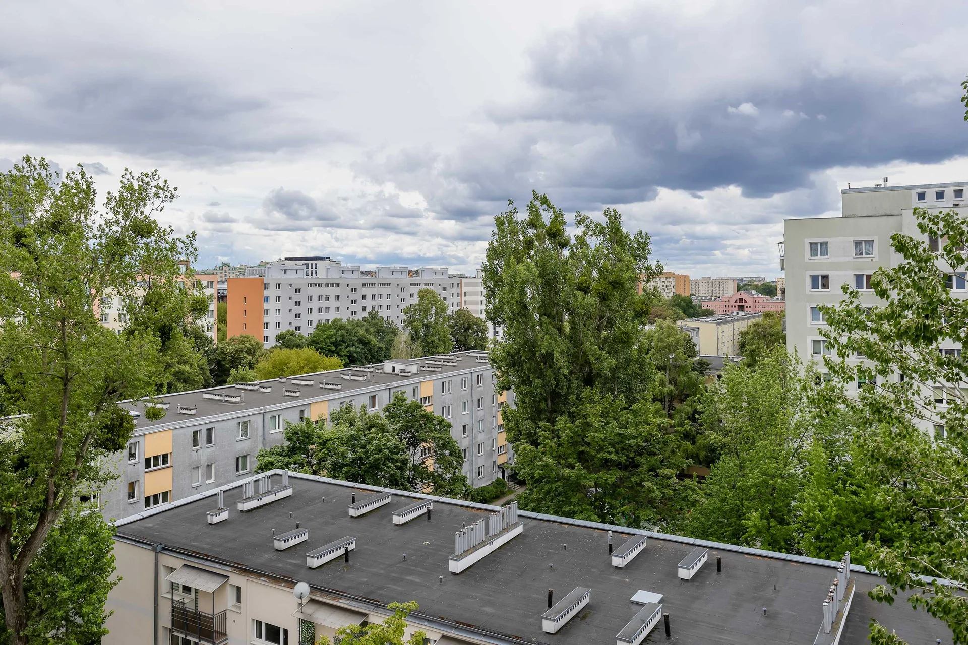 Pleasant view overlooking green trees and the surrounding residential neighborhood.