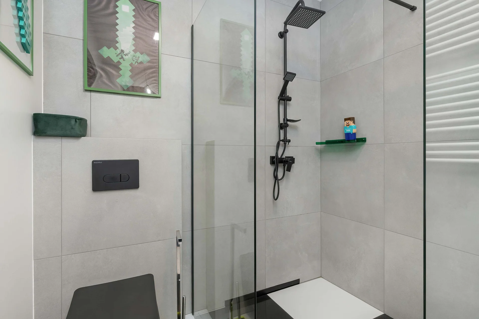 The bathroom's contemporary design includes fresh towels and a hairdryer.