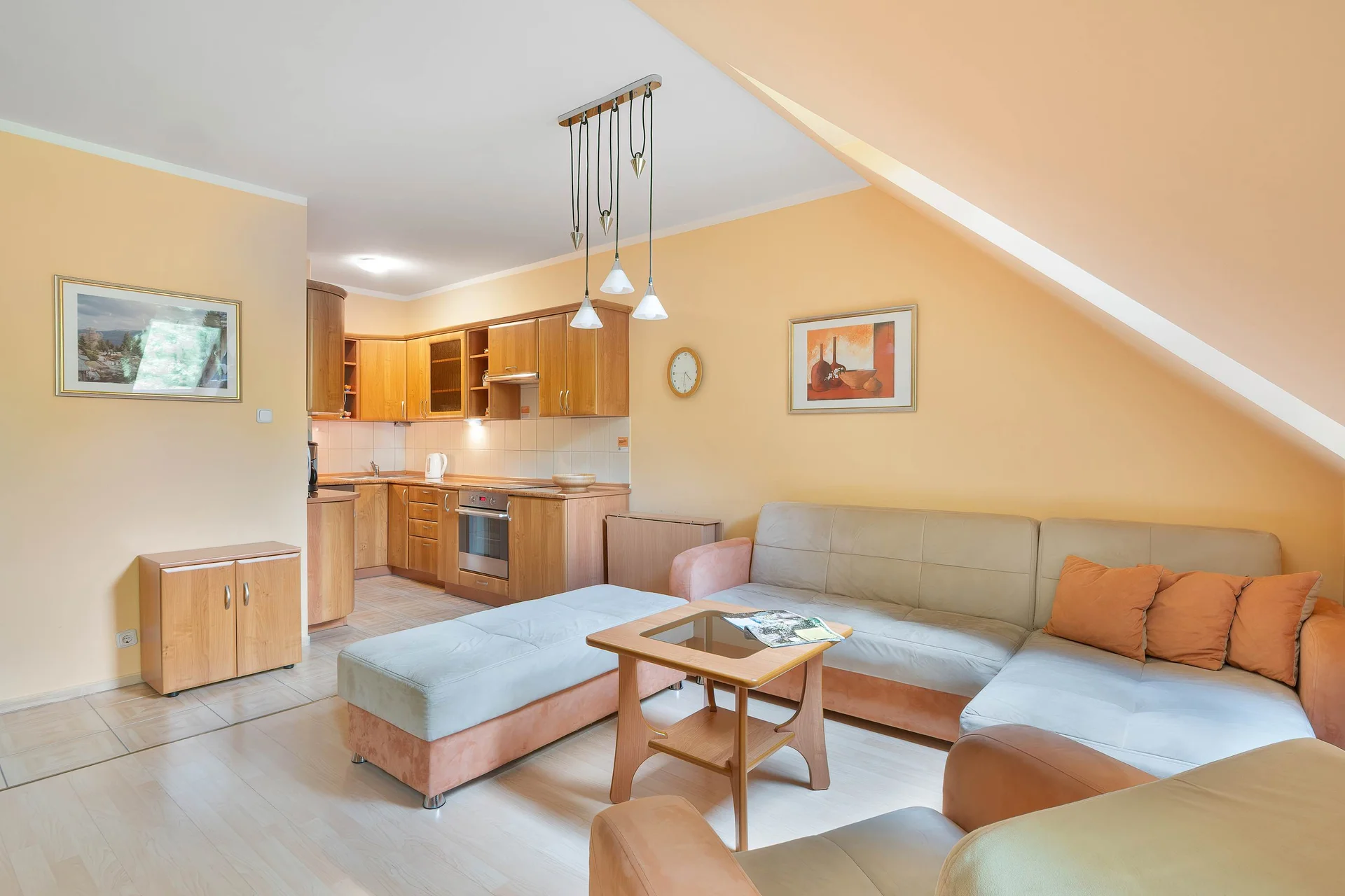 A cozy lounge with a large corner sofa and coffee table. The room is perfect for spending quality time together.