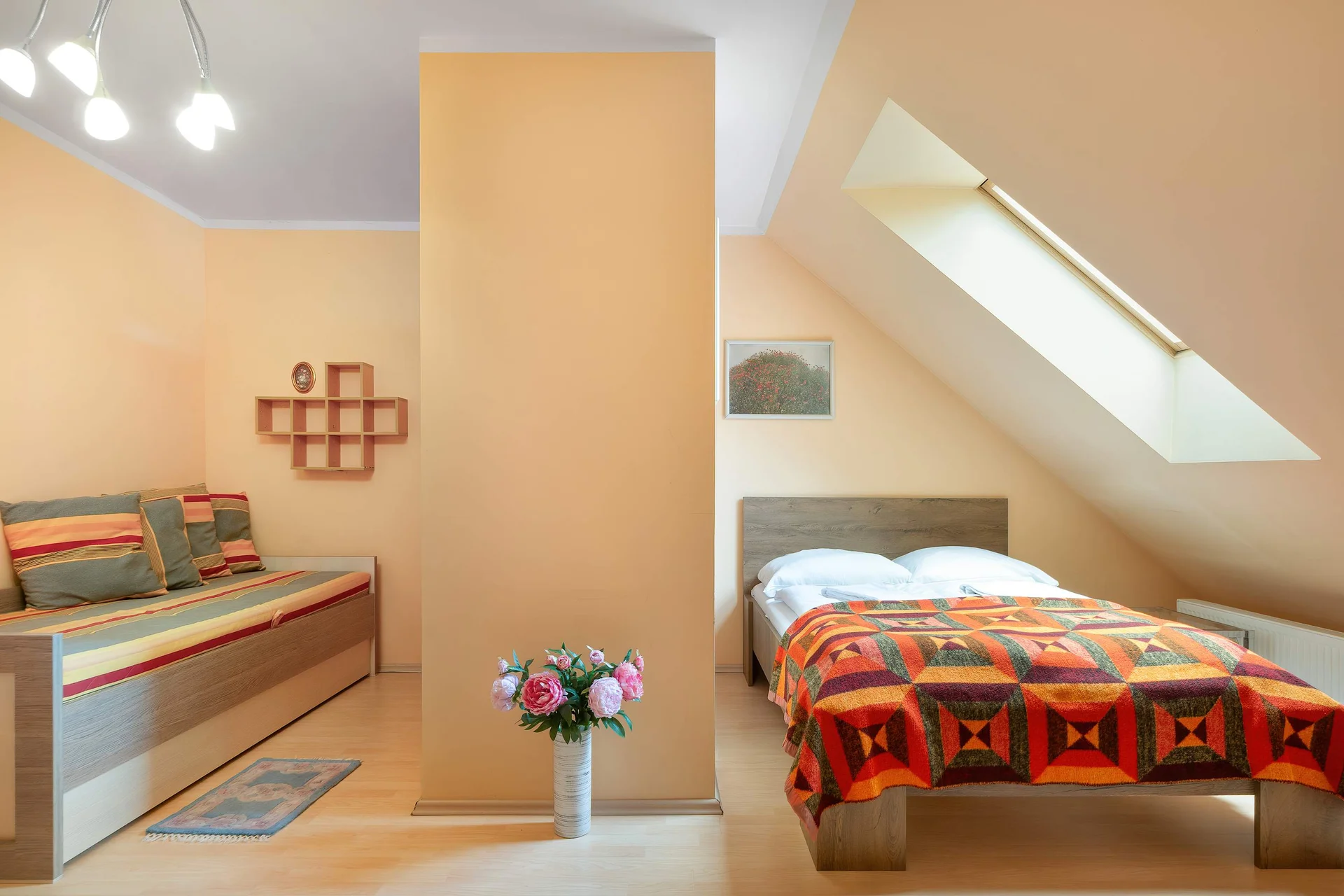 A cozy bedroom with comfortable beds and warm décor. It's an ideal place to recharge after a busy day.
