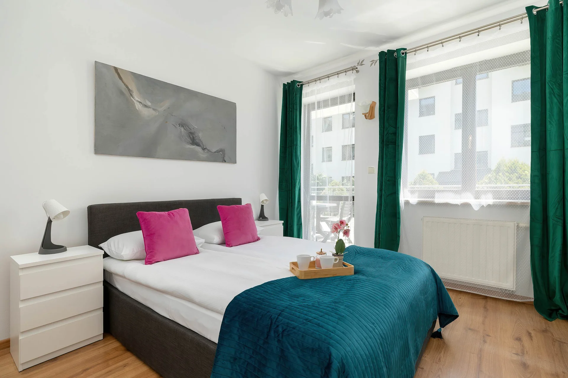 The cosy bedroom features a luxurious double bed and ample storage.
