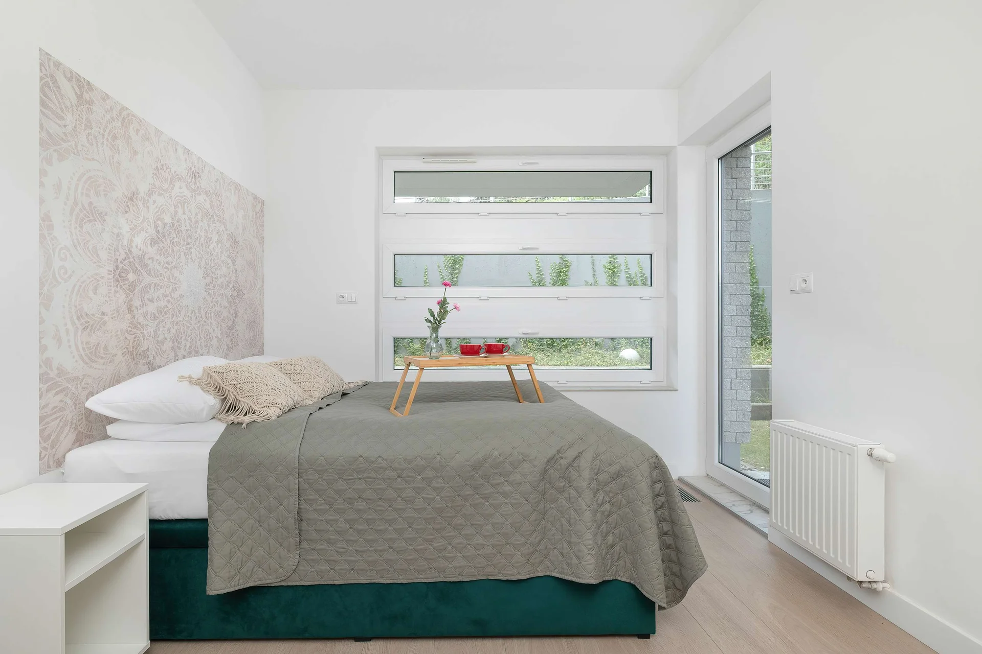 The bedroom's elegant decor creates a serene and restful environment.