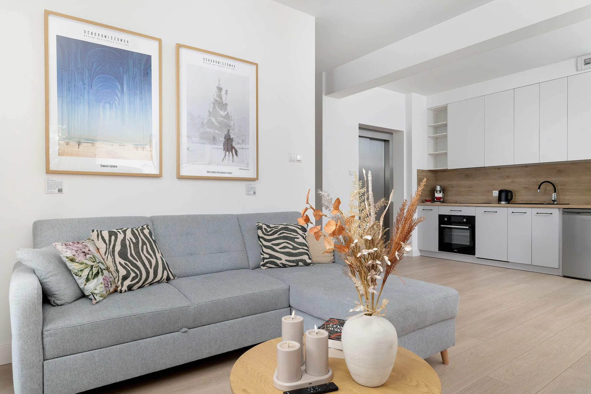 Relax in the stylish living room with a comfortable sofa and modern decor.