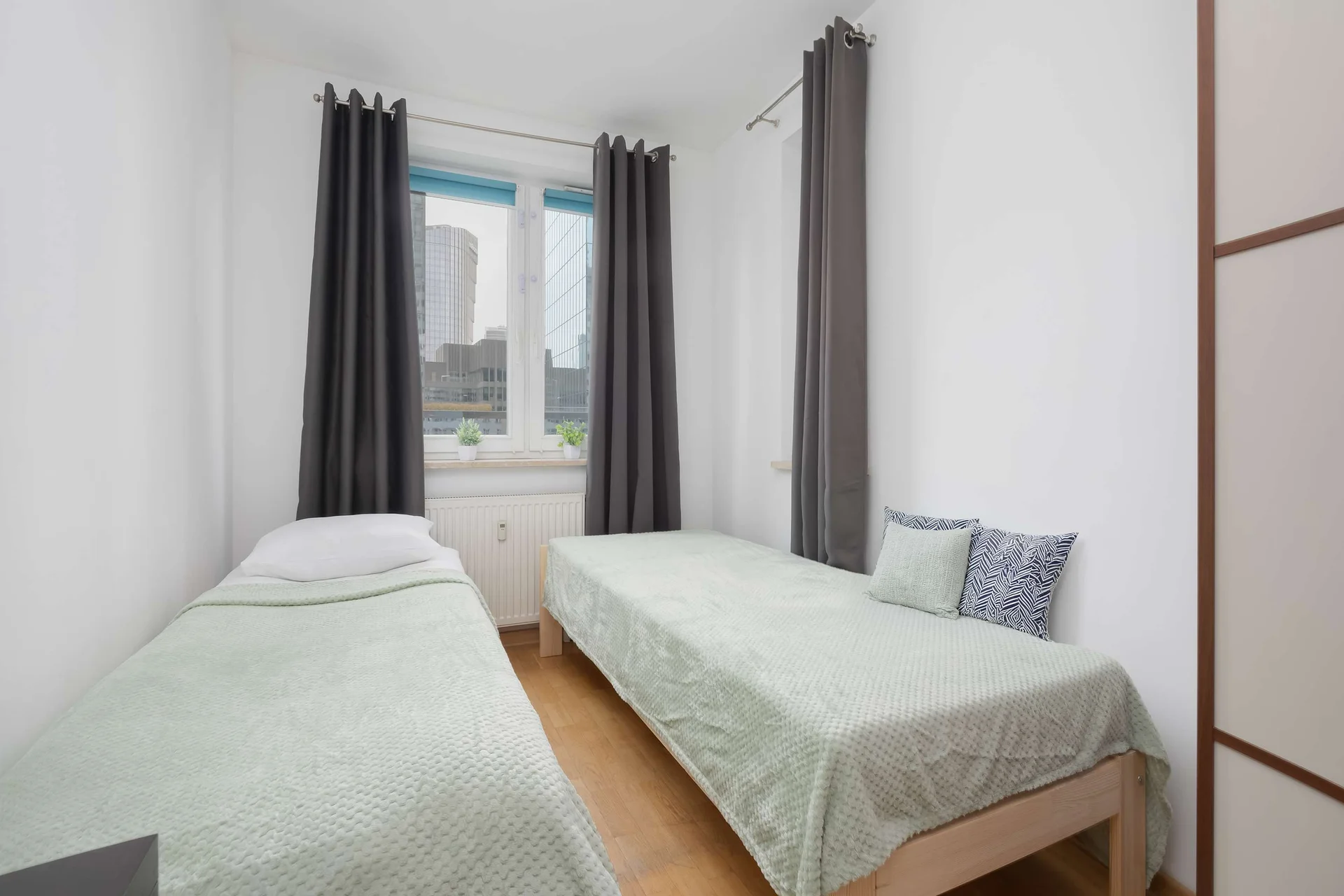 A cozy bedroom with two comfortable single bed. It's perfect for friends, children, or colleagues traveling together.