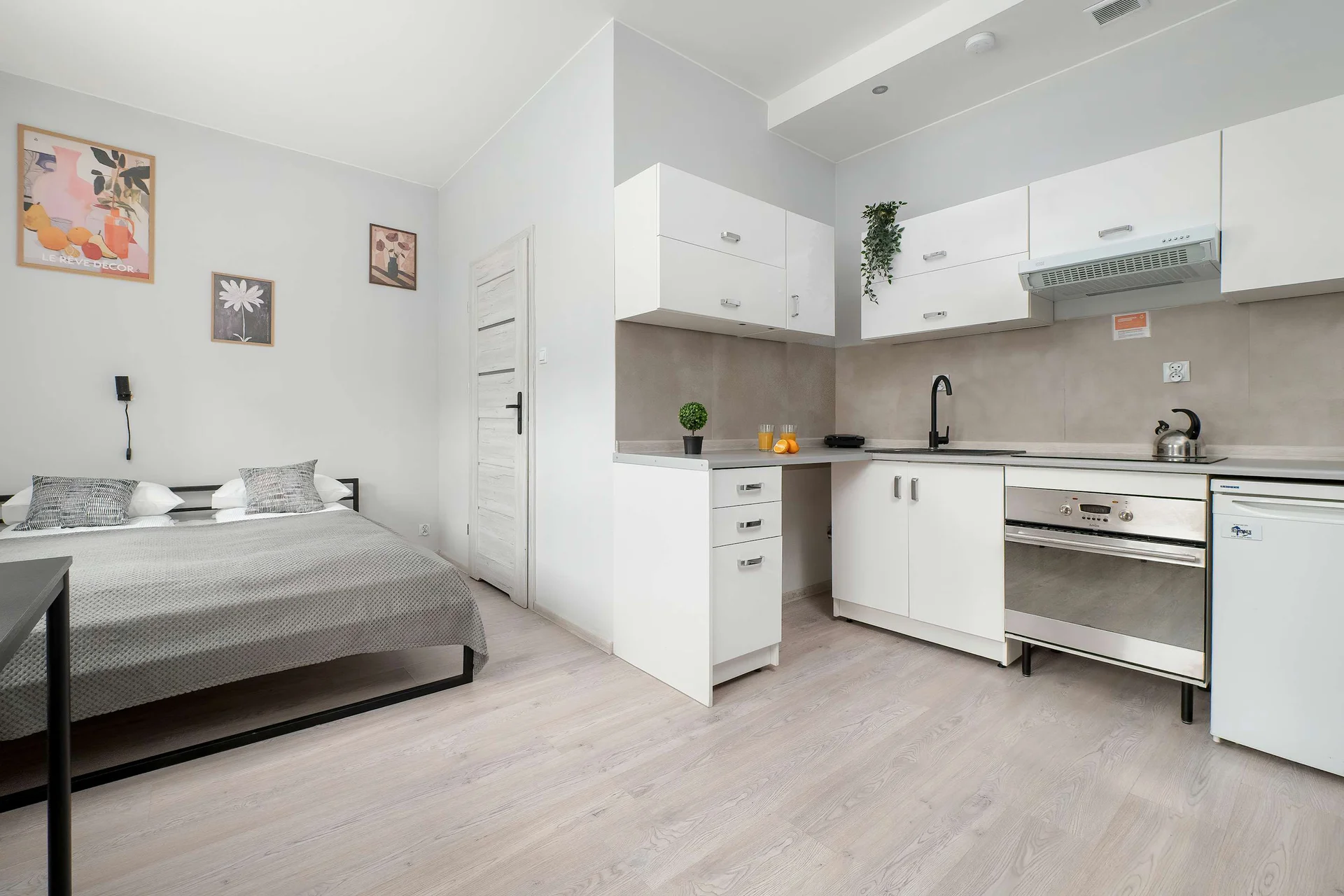 An open-plan studio combining the bedroom and kitchen. Modern appliances provide everything needed for a comfortable stay.