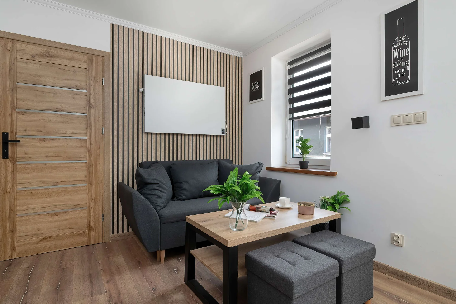 Relax in the stylish living room with a comfortable sofa and modern decor.