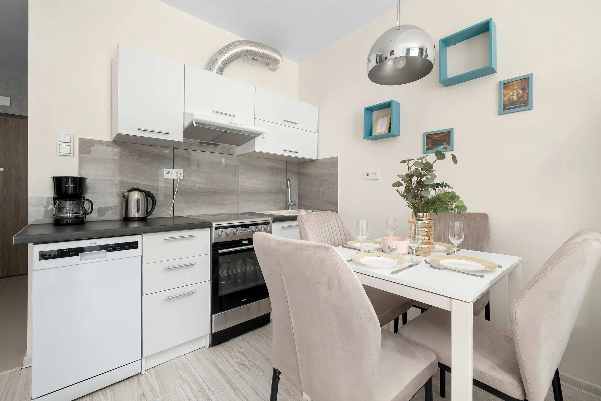 The bright kitchenette offers all the essentials for cooking during your stay. A cozy dining table provides the perfect spot for shared meals.