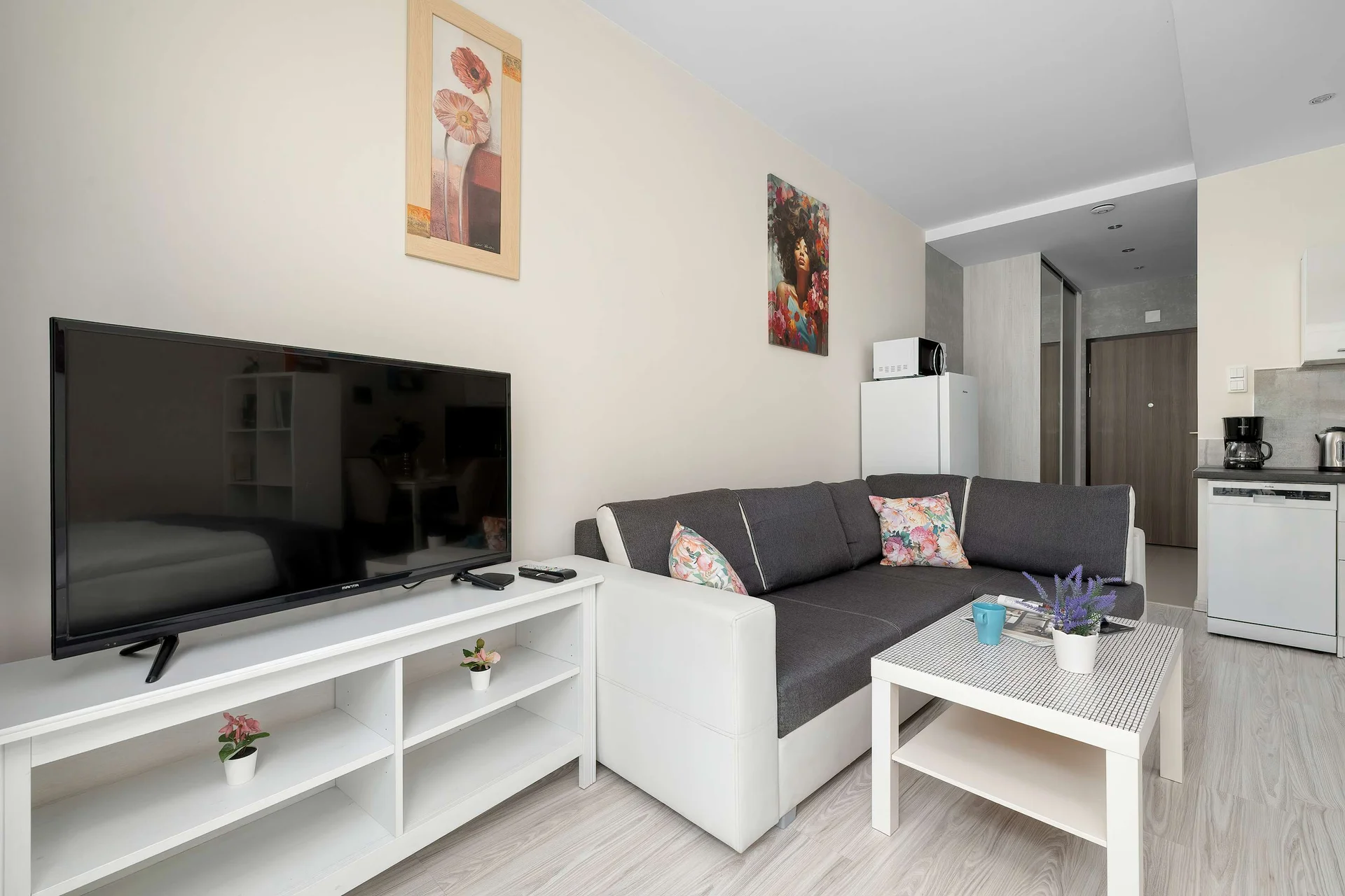 Relax on the comfortable sofa while watching your favorite shows on the Smart TV. The modern living space is ideal for spending quality time indoors.