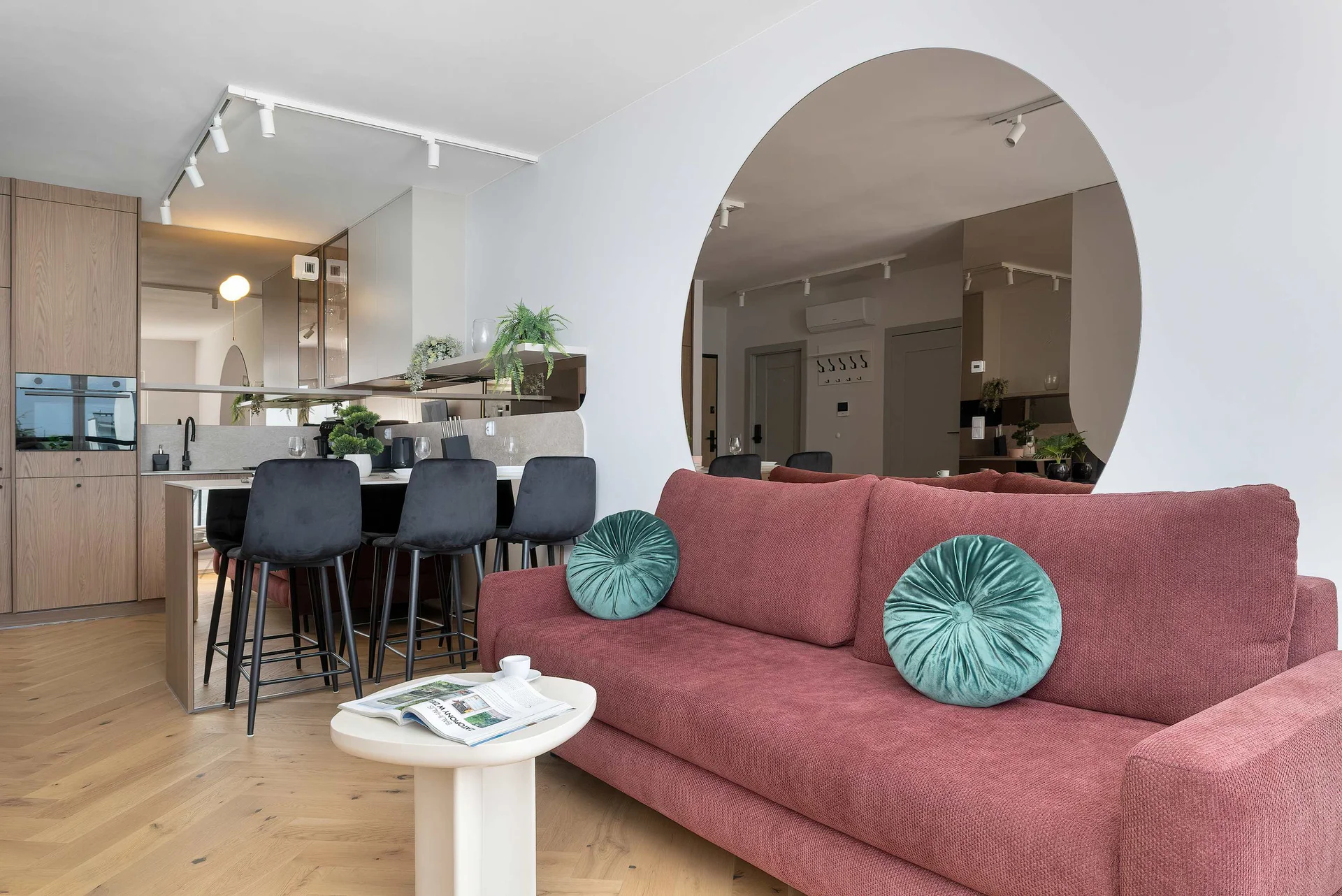 Relax in the stylish living room with a comfortable sofa and modern decor.