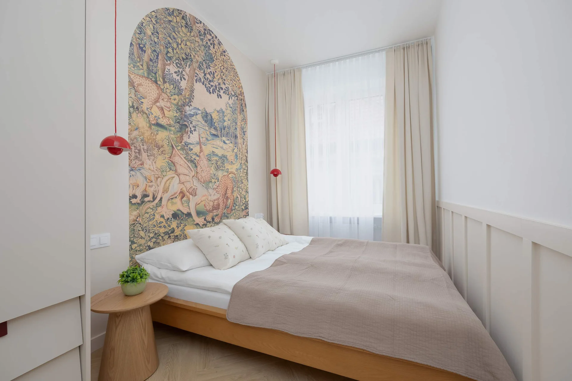 The cosy bedroom features a luxurious double bed and ample storage.