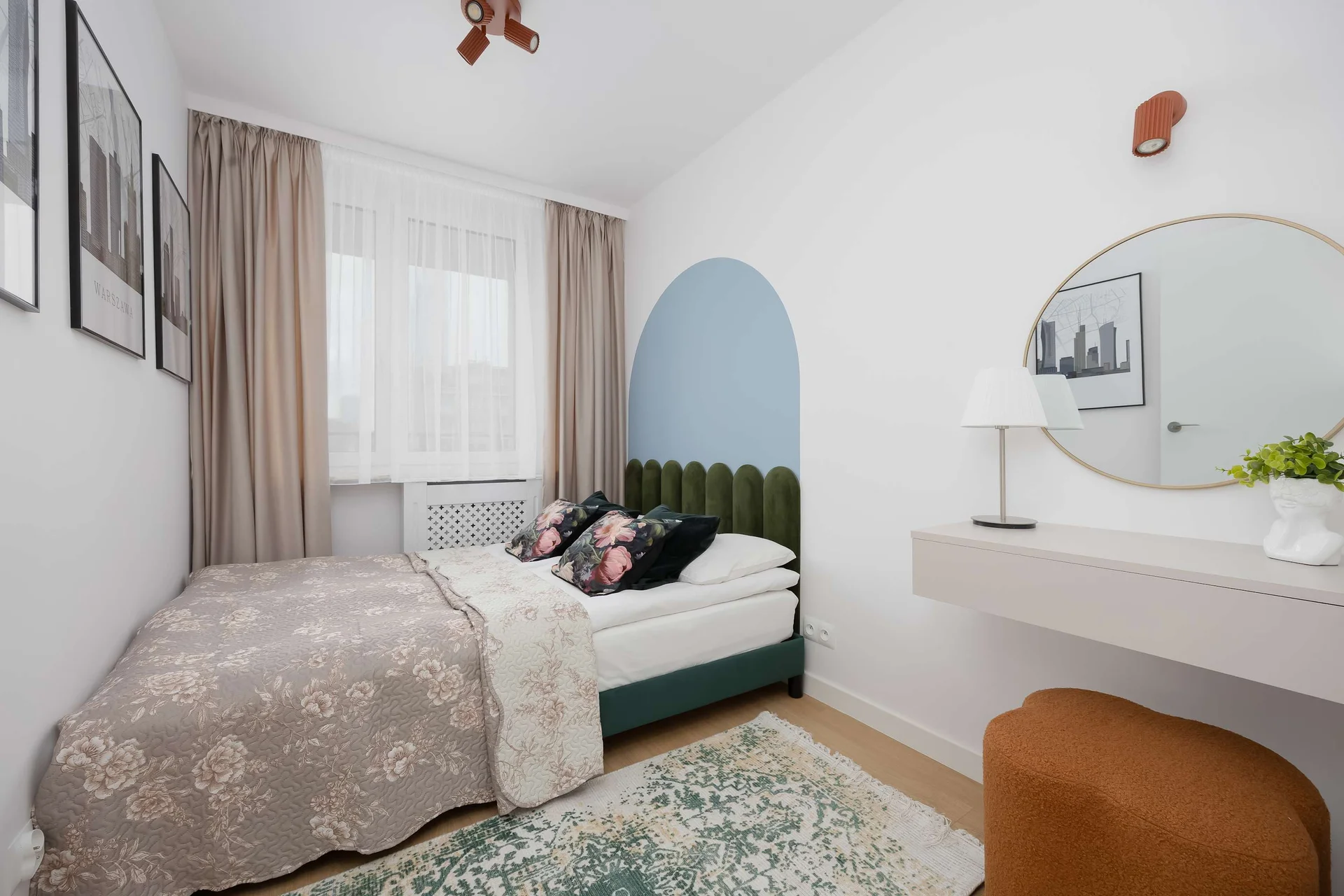 The bedroom's modern design ensures a comfortable stay.