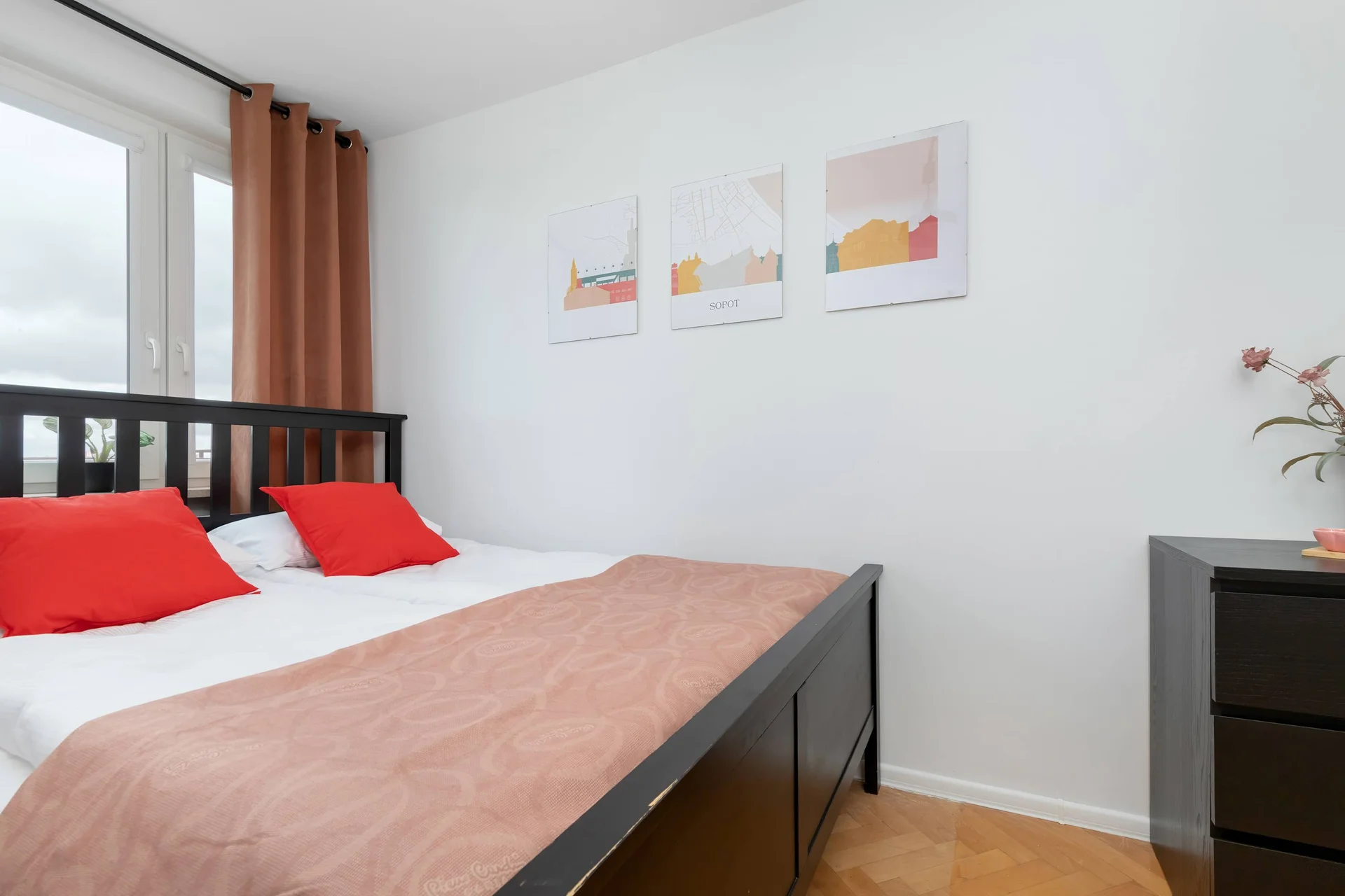 Cozy bedroom with a double bed, bedside tables, and minimalist décor.