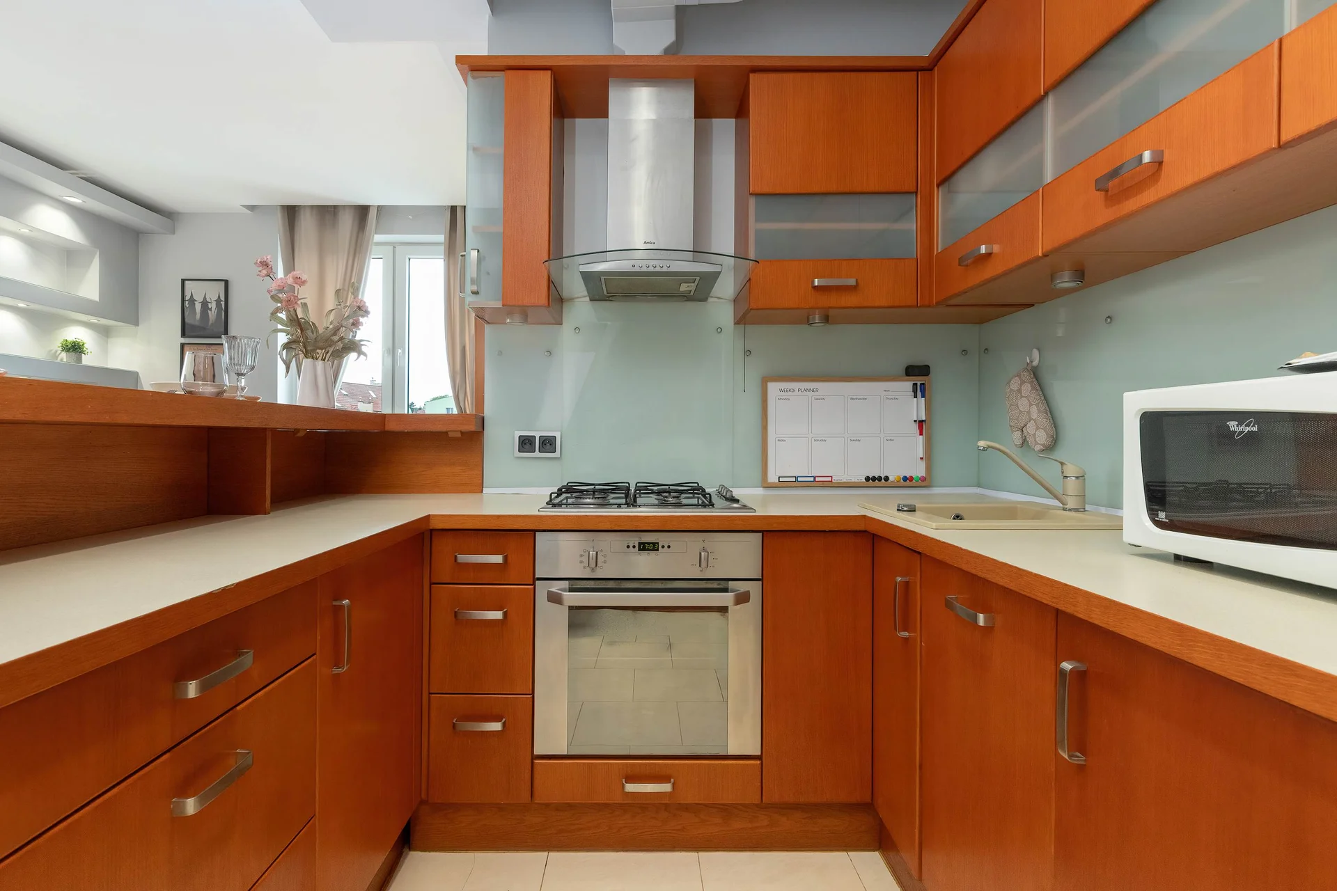 The sleek design of the kitchenette blending seamlessly with the living area.