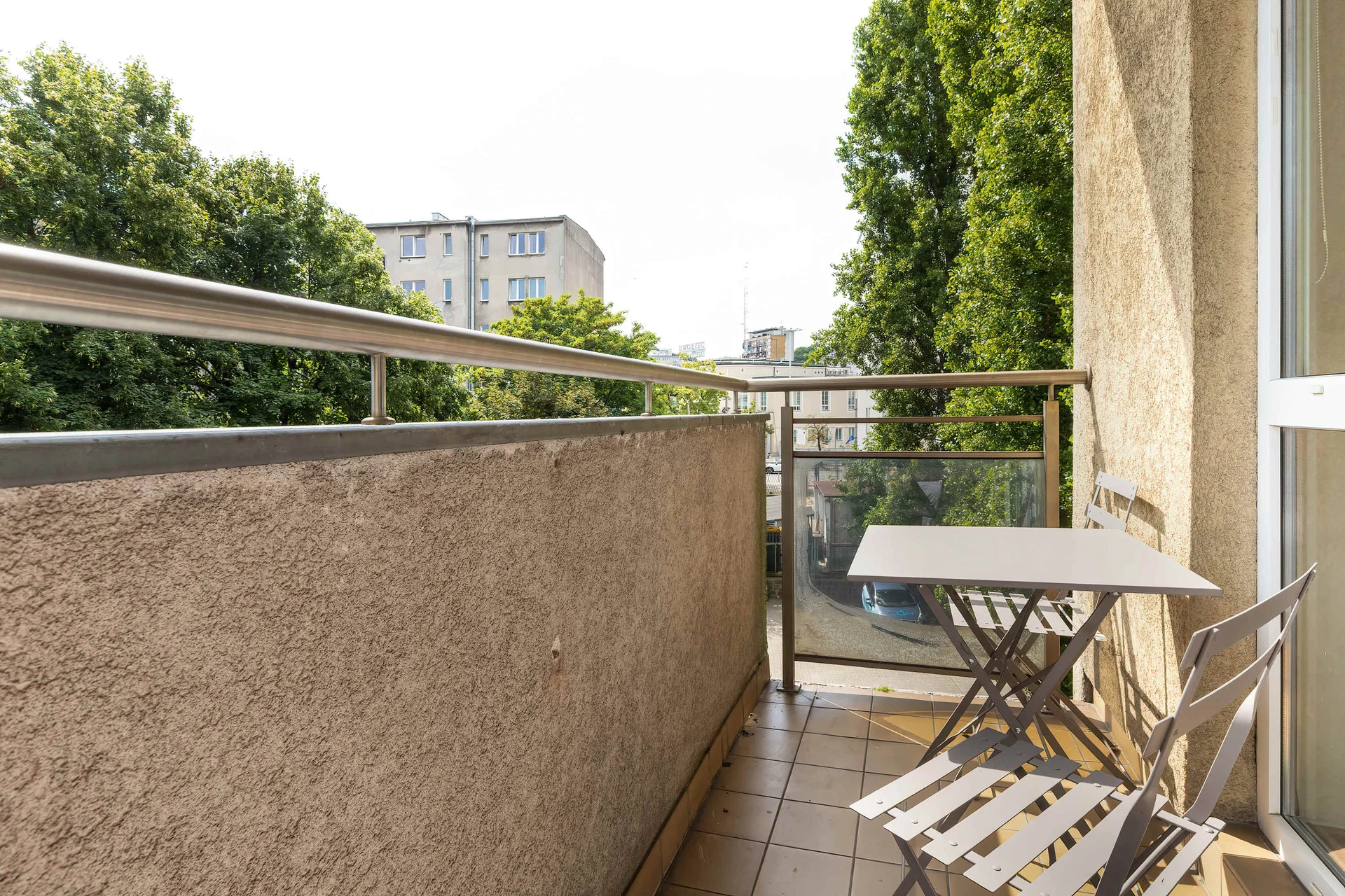 The balcony provides a perfect spot for enjoying the fresh air.