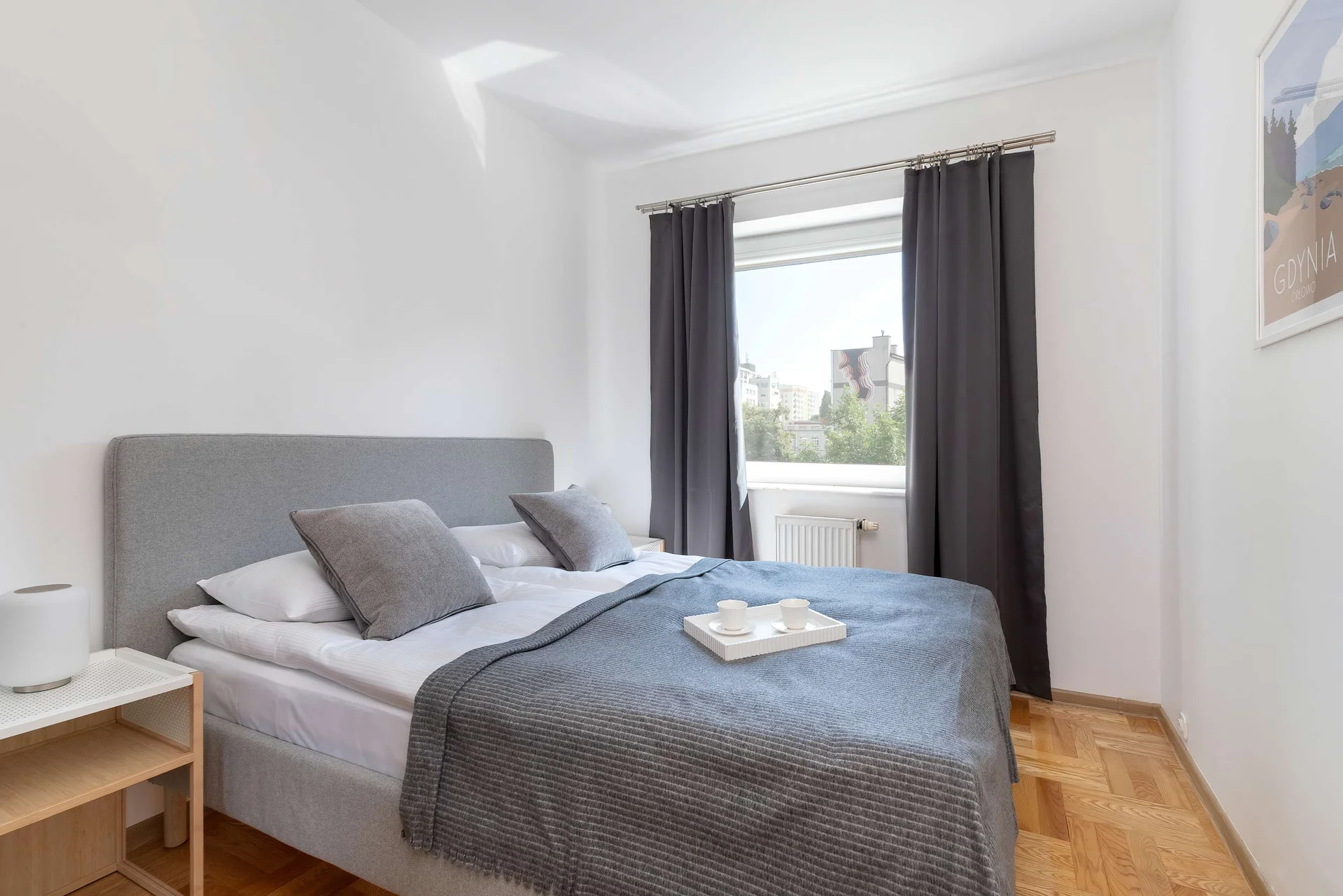 The cosy bedroom features a luxurious double bed and ample storage.