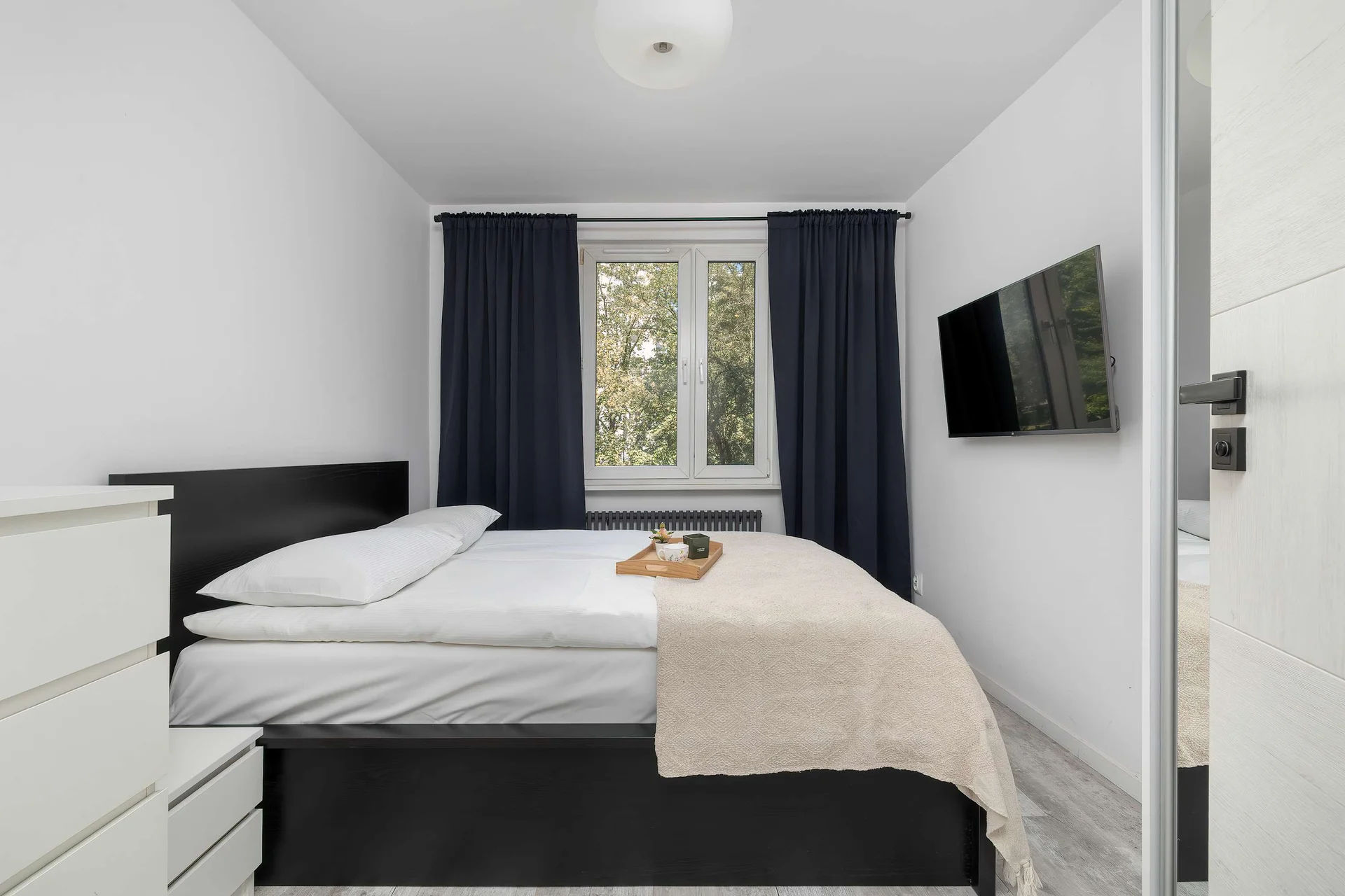 The bedroom's elegant decor creates a serene and restful environment.