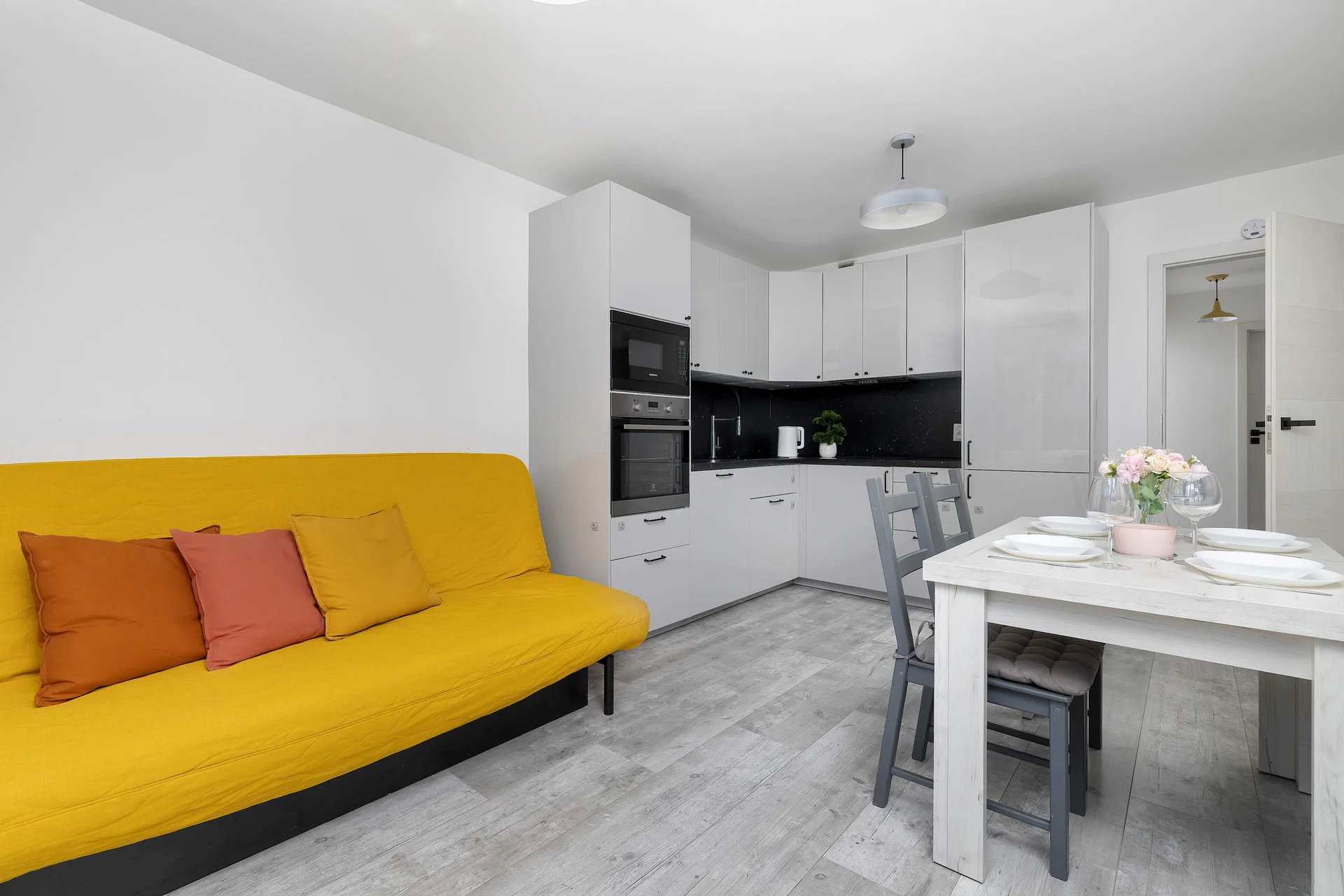 Relax in the stylish living room with a comfortable sofa and modern decor.