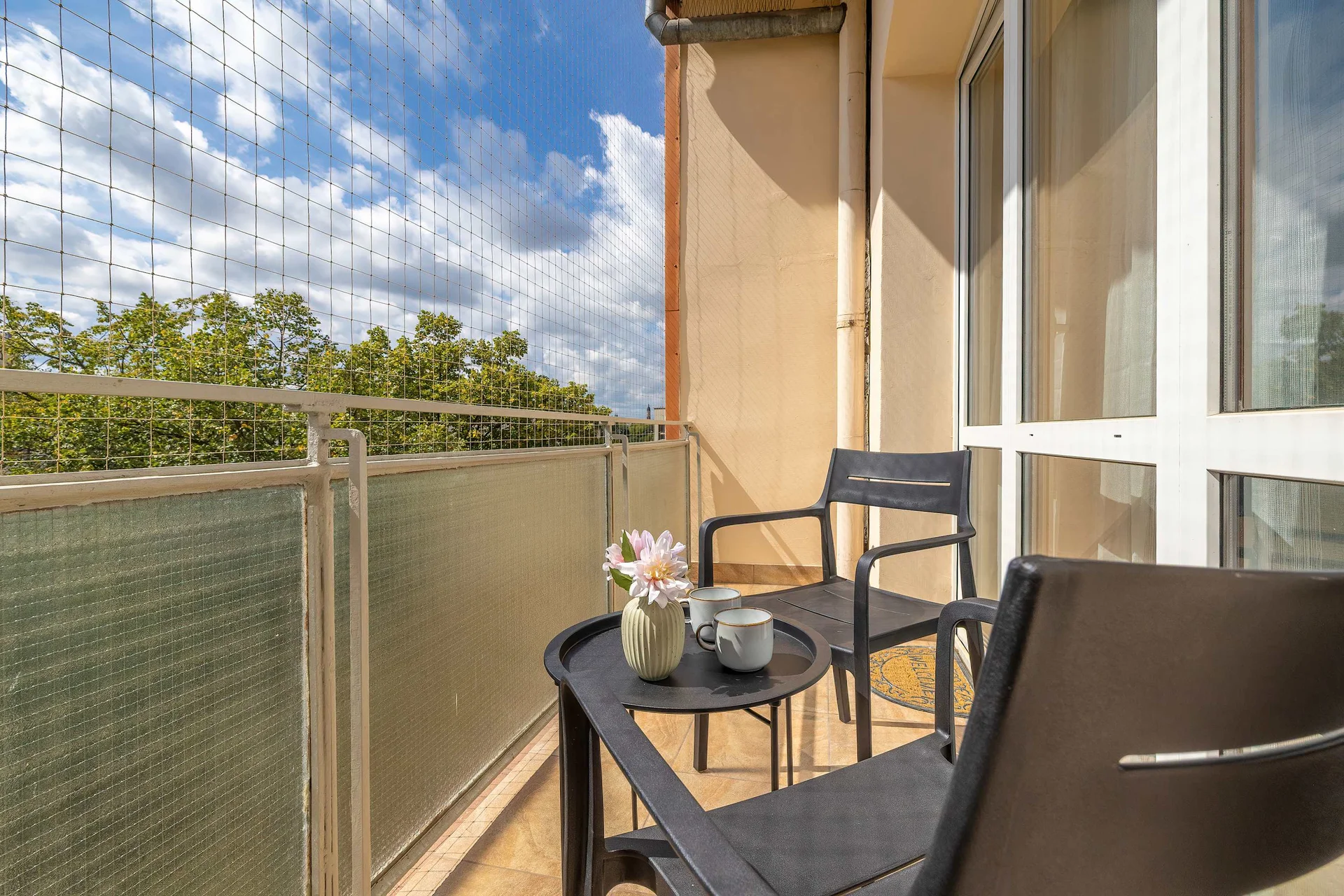 The balcony provides a perfect spot for enjoying the fresh air.