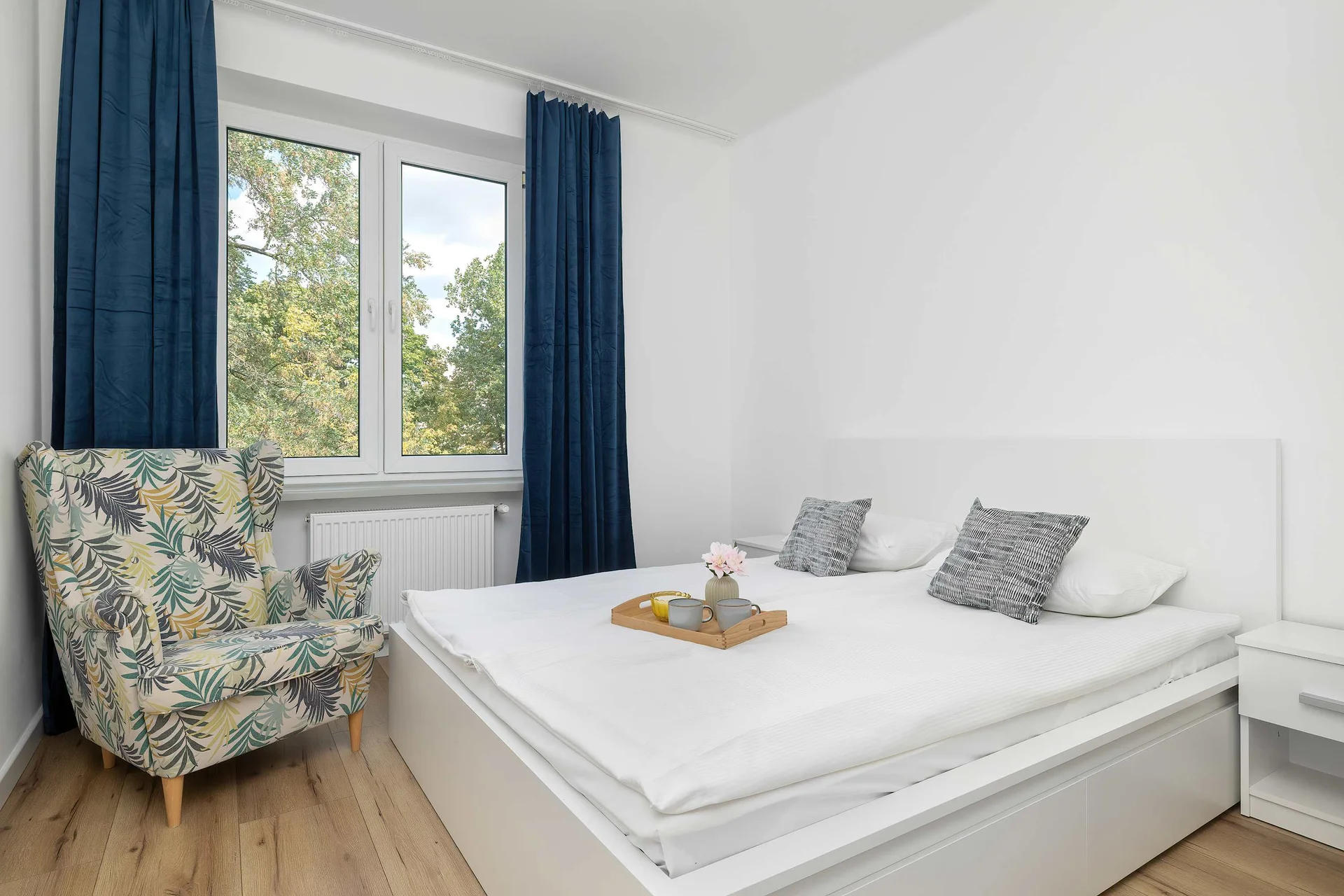 The bedroom's elegant decor creates a serene and restful environment.