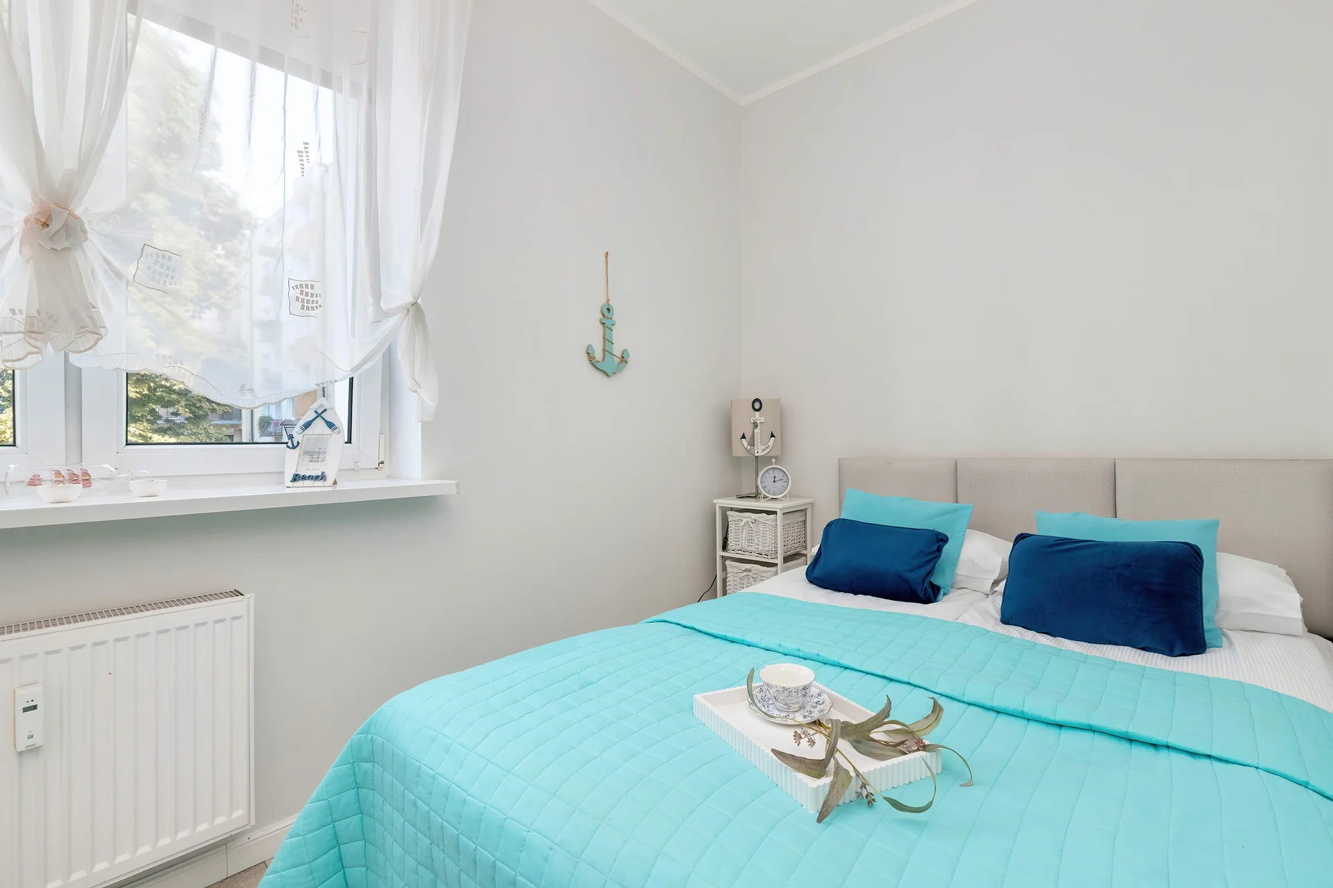 The bedroom's elegant decor creates a serene and restful environment.