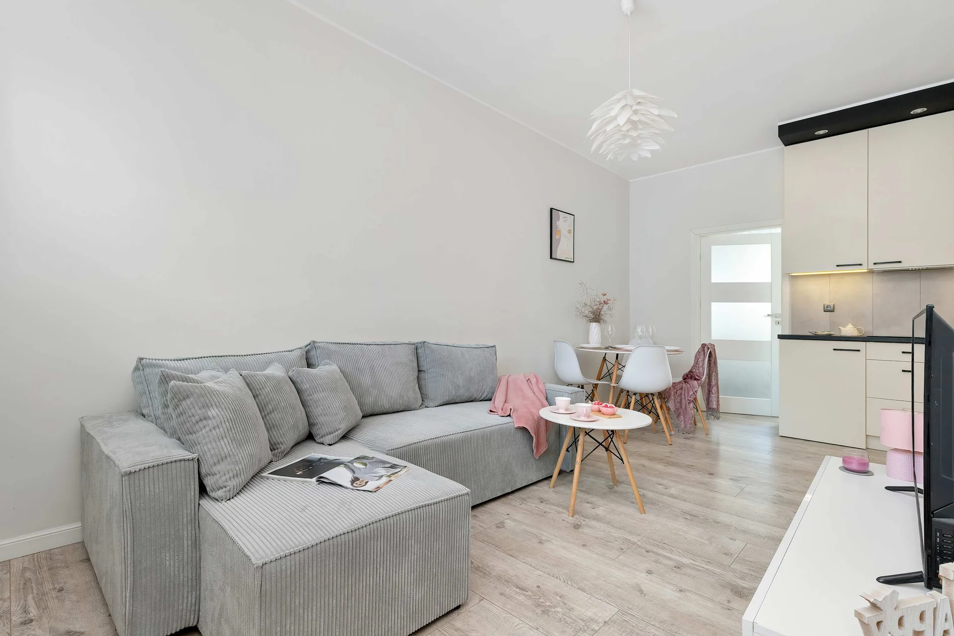 Relax in the stylish living room with a comfortable sofa and modern decor.