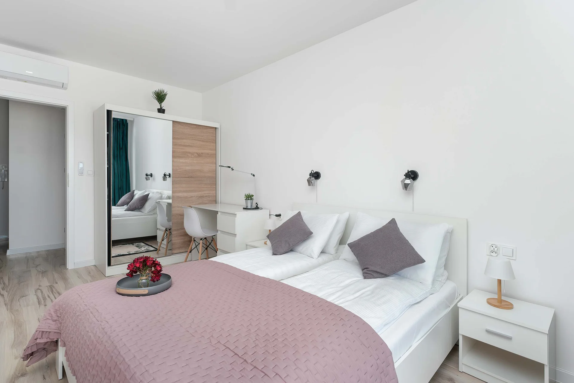 The bedroom's elegant decor creates a serene and restful environment.