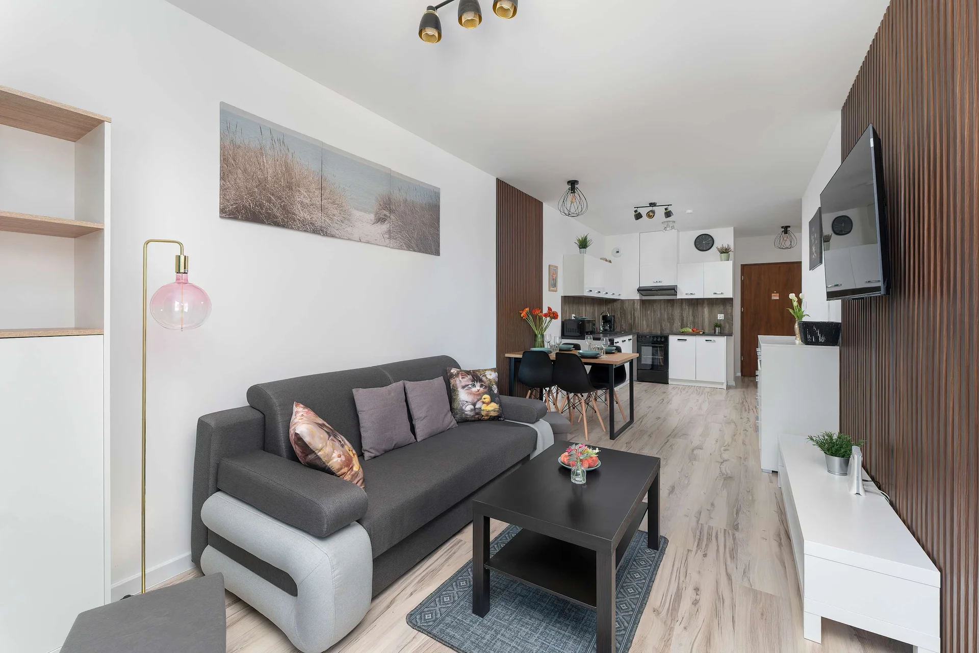 Relax in the stylish living room with a comfortable sofa and modern decor.