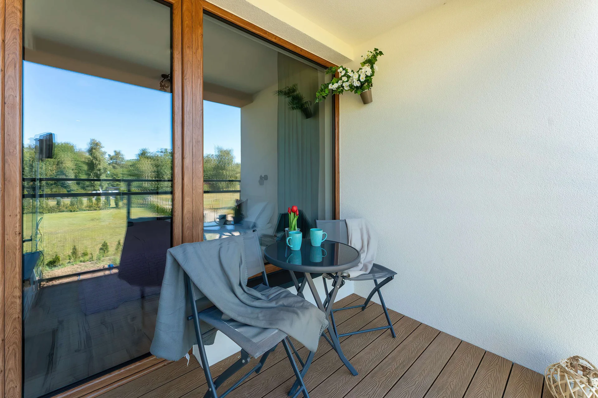 The balcony provides a perfect spot for enjoying the fresh air.