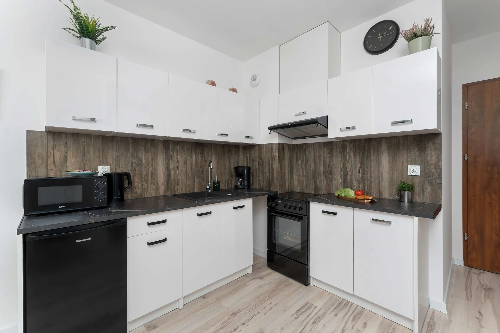 The fully equipped kitchenette includes everything you need for a home-cooked meal.