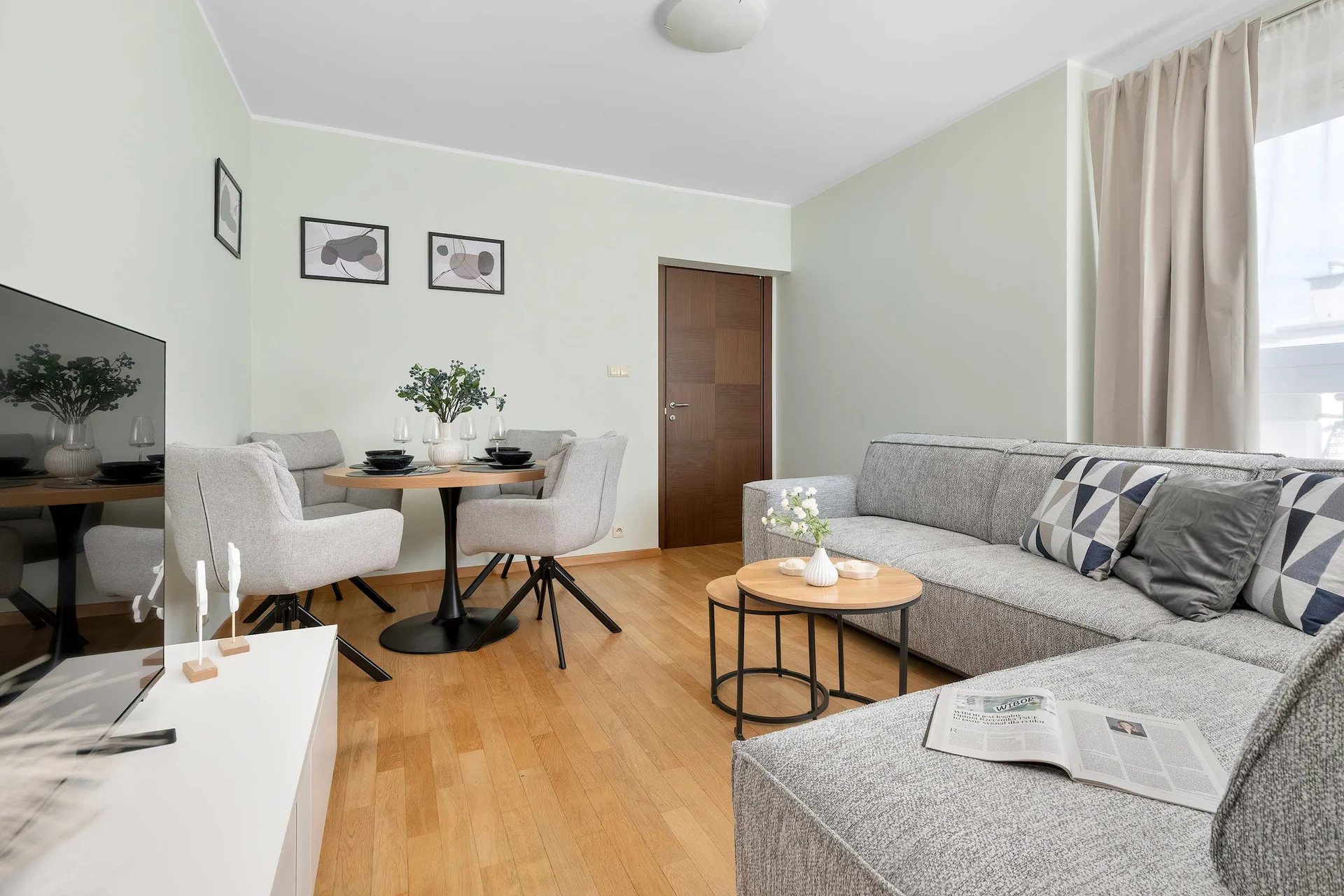 The stylish bedroom includes a comfortable sofa bed.